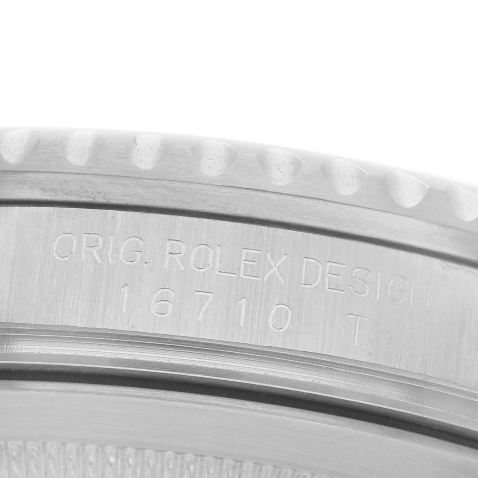 The image shows a detailed close-up of the side of a Rolex GMT-Master 16710 Men's Stainless Steel Black Dial 16710 Men's Stainless Steel Black Dial, highlighting the engraved model number "16710 T."
