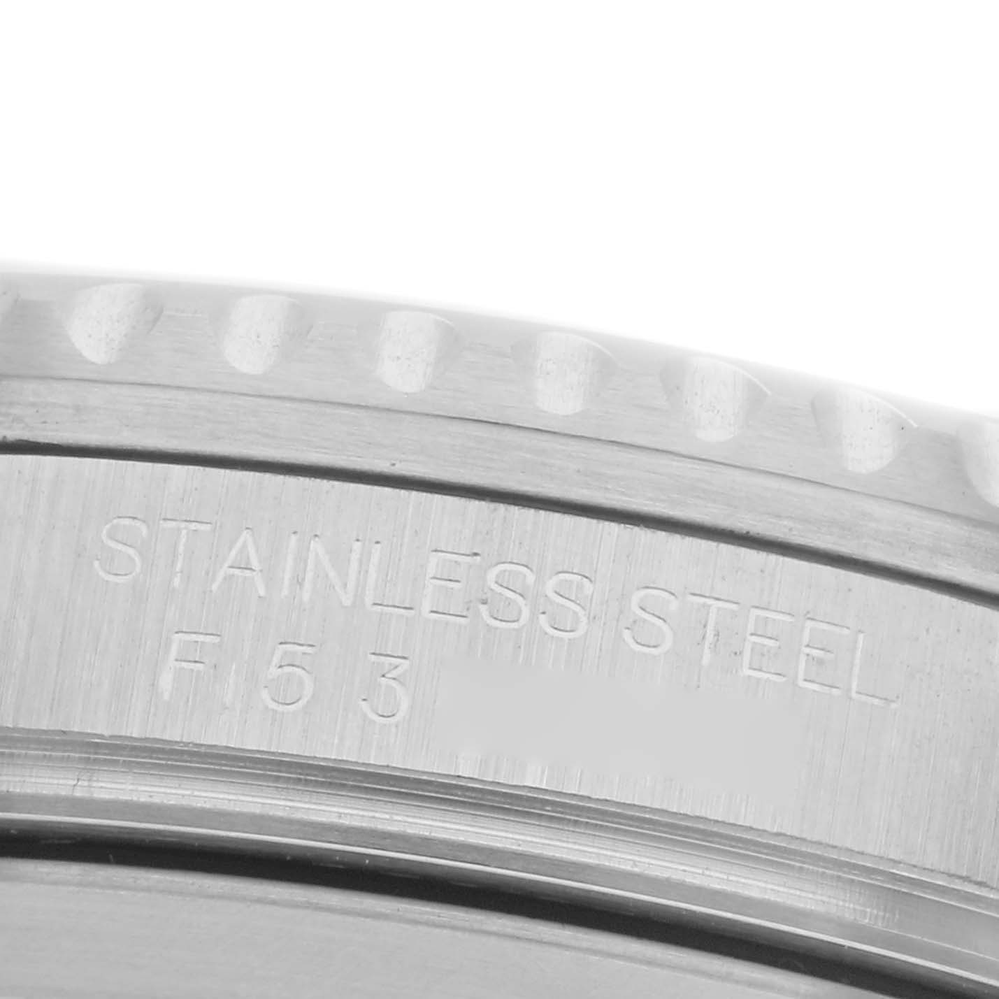 The image shows a close-up of the side of a stainless steel Rolex GMT-Master 16710 Men's Stainless Steel Black Dial 16710 Men's Stainless Steel Black Dial, highlighting the engraved detailing.