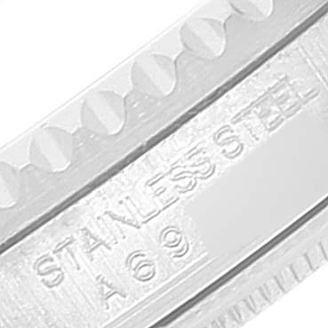 This close-up image shows a portion of the stainless steel bezel of a Rolex GMT-Master 16710 Men's Stainless Steel Black Dial 16710 Men's Stainless Steel Black Dial watch.