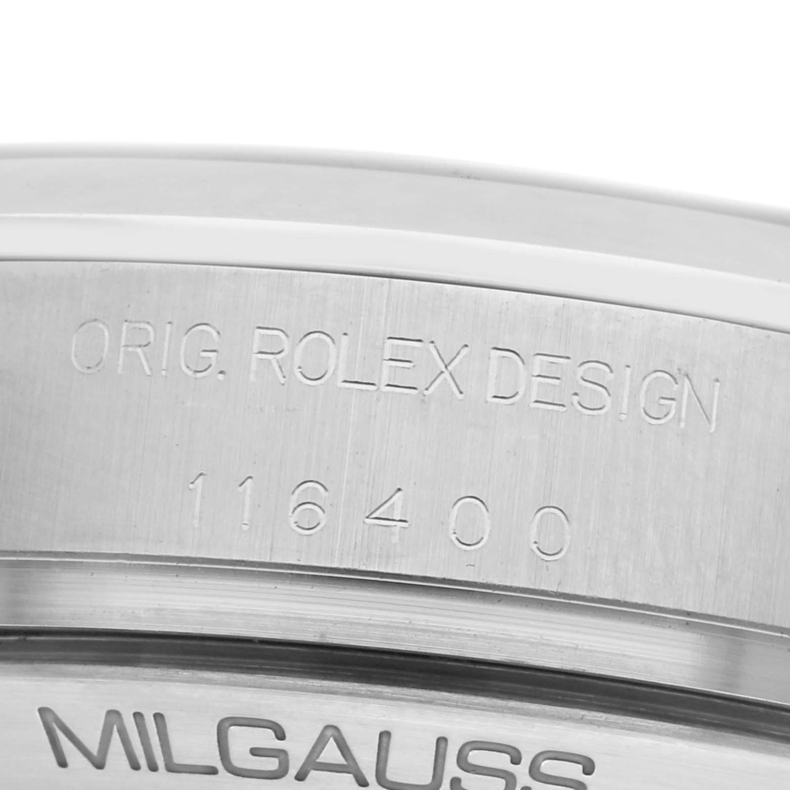 The image shows a close-up of the side engraving on a Rolex Milgauss 116400 Men's Stainless Steel White Dial 116400 Men's Stainless Steel White Dial watch with model number visible.