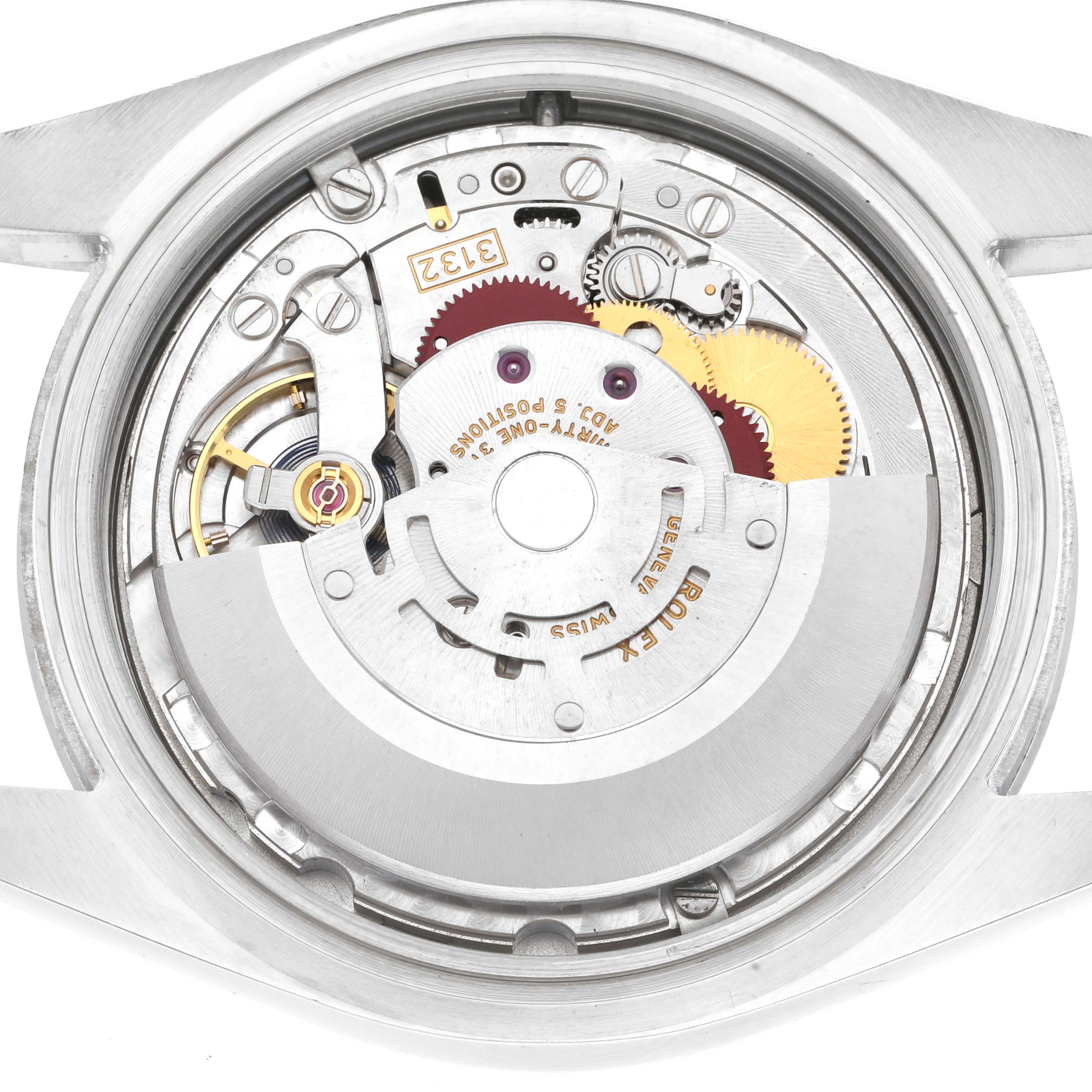 This image shows a close-up view of the inner mechanism of a Rolex Oyster Perpetual 114300 Men's Stainless Steel Grey Dial 114300 Men's Stainless Steel Grey Dial watch, highlighting its intricate gears and components.