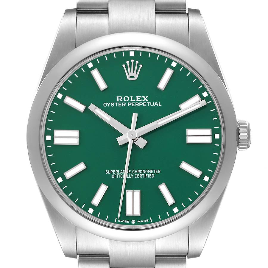 The Rolex Oyster Perpetual watch is shown from a front angle, displaying its green dial and stainless steel bracelet.