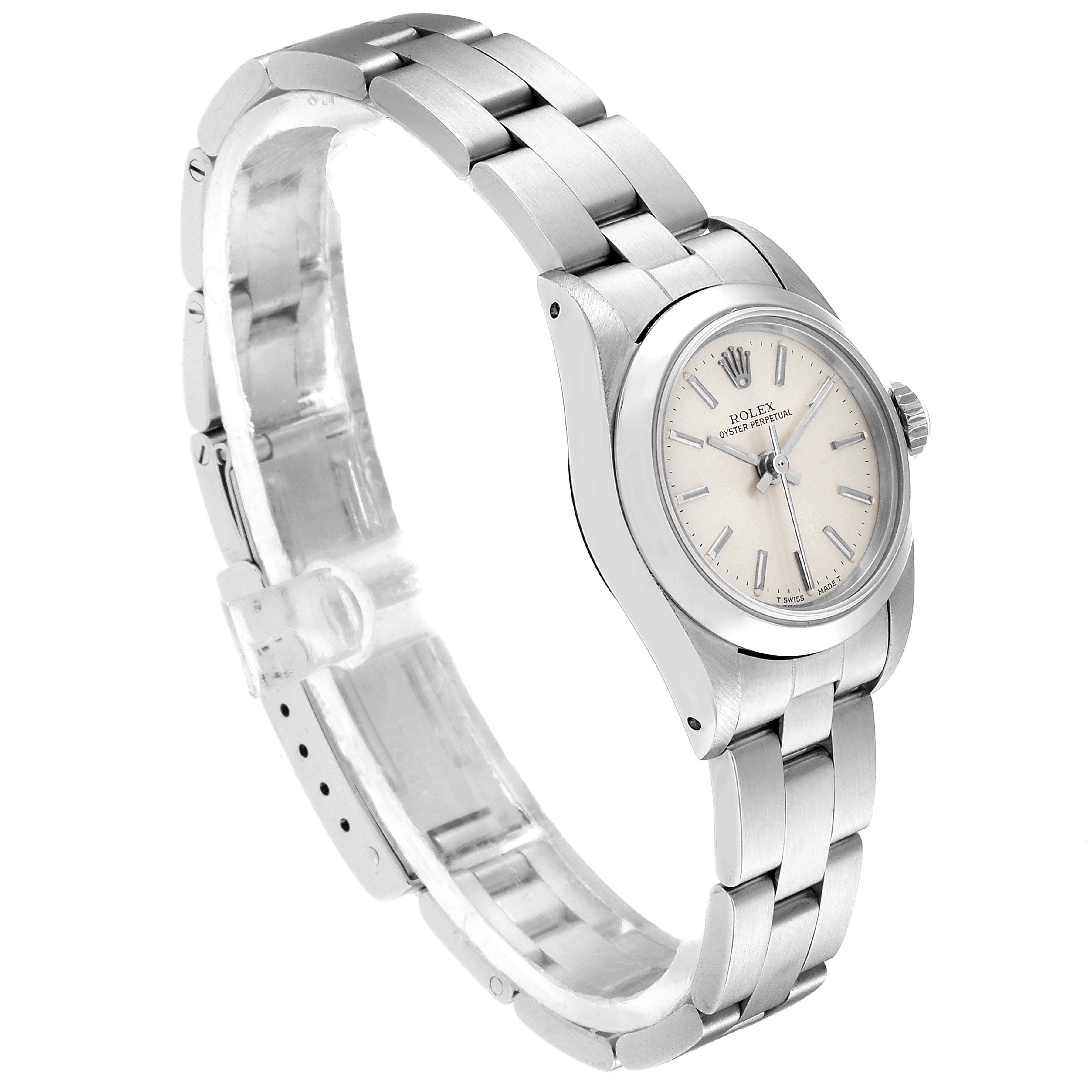 This image shows a Rolex Oyster Perpetual 67180 Women's Stainless Steel Silver Dial 67180 Women's Stainless Steel Silver Dial watch angled slightly from the side, revealing the face, bracelet, and clasp.