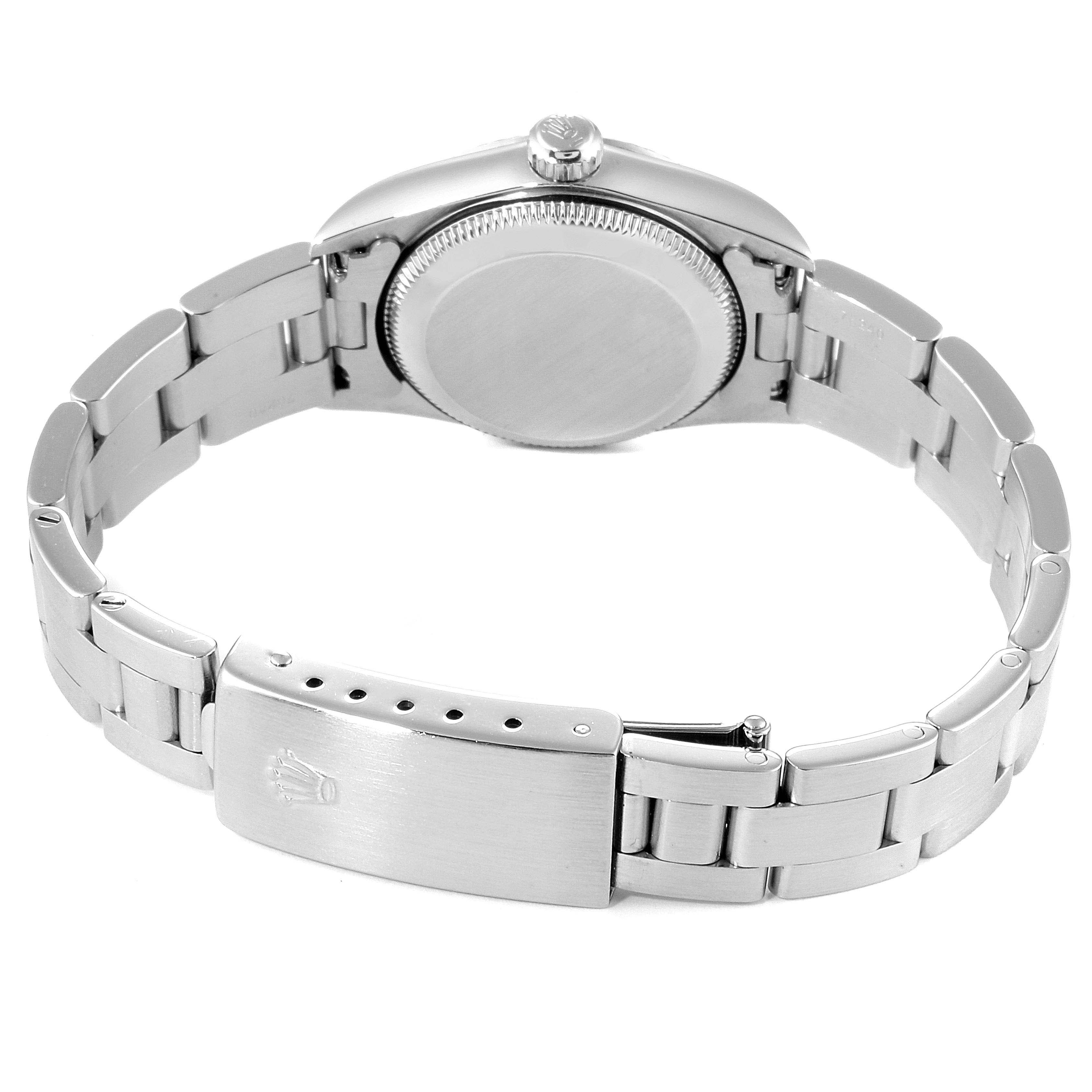 This image shows the back view of a Rolex Oyster Perpetual 76094 Women's Stainless Steel Silver Dial 76094 Women's Stainless Steel Silver Dial watch, highlighting the case back and metal bracelet with clasp.