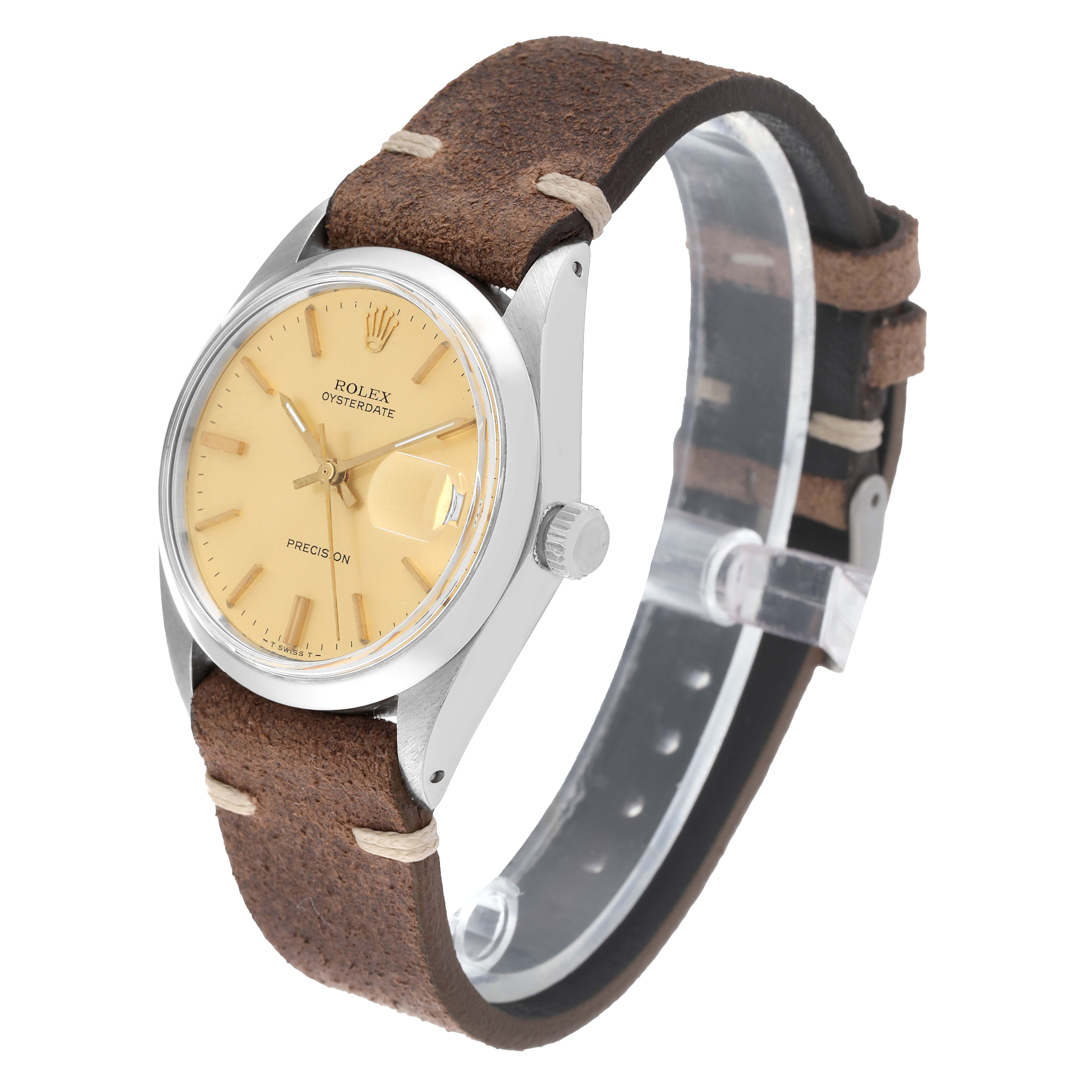 The image shows a Rolex Vintage Collection 6694 Men's Stainless Steel Champagne Dial 6694 Men's Stainless Steel Champagne Dial watch, angled to display the face, bezel, crown, and leather strap.