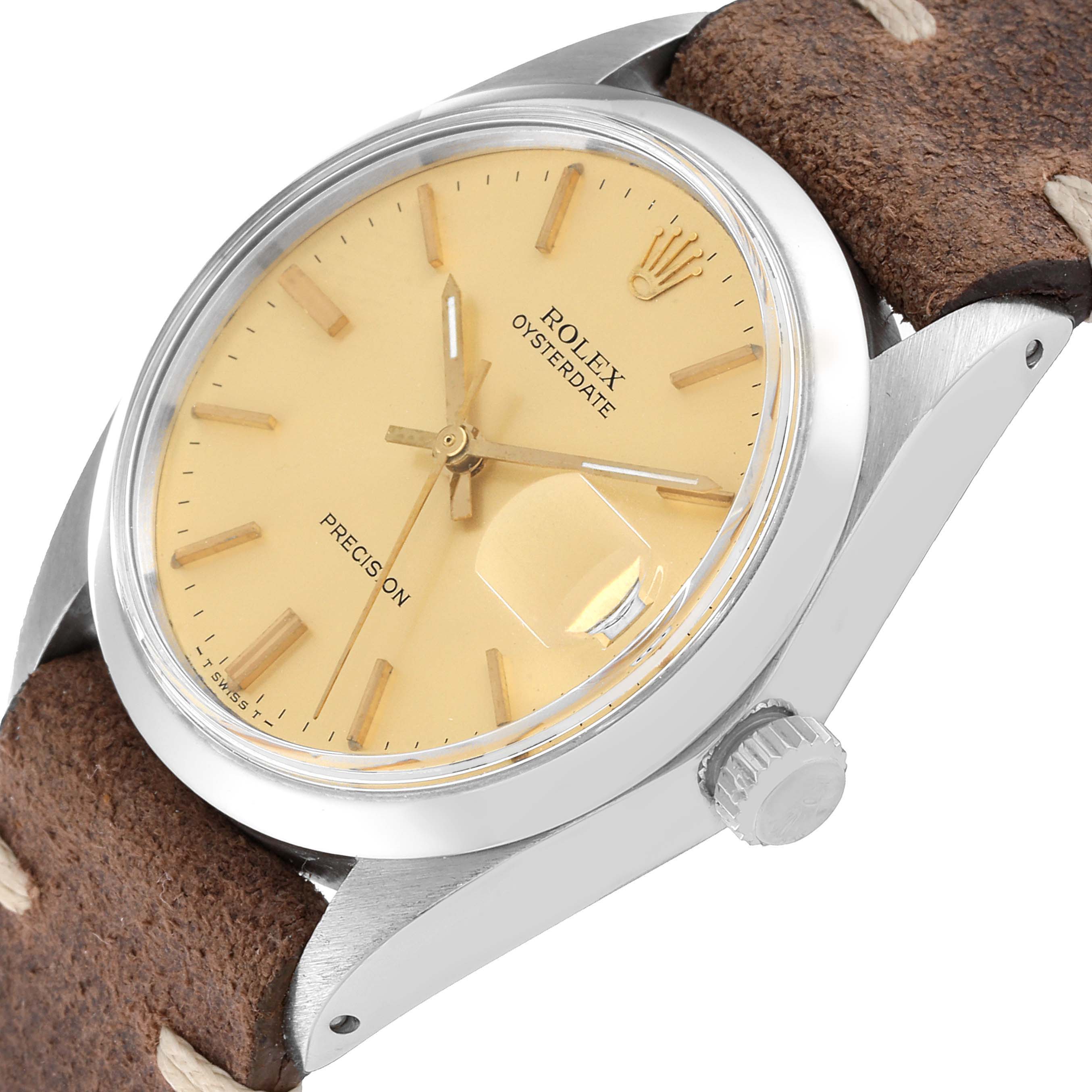 The image shows a side and partial front view of the Rolex Vintage Collection 6694 Men's Stainless Steel Champagne Dial 6694 Men's Stainless Steel Champagne Dial Oysterdate watch, highlighting the dial, crown, and part of the suede strap.