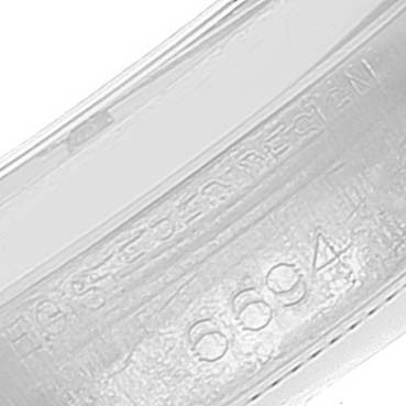 This close-up image shows the inner side of the band of a Rolex Vintage Collection 6694 Men's Stainless Steel Champagne Dial 6694 Men's Stainless Steel Champagne Dial model, with the model number 6694 inscribed.