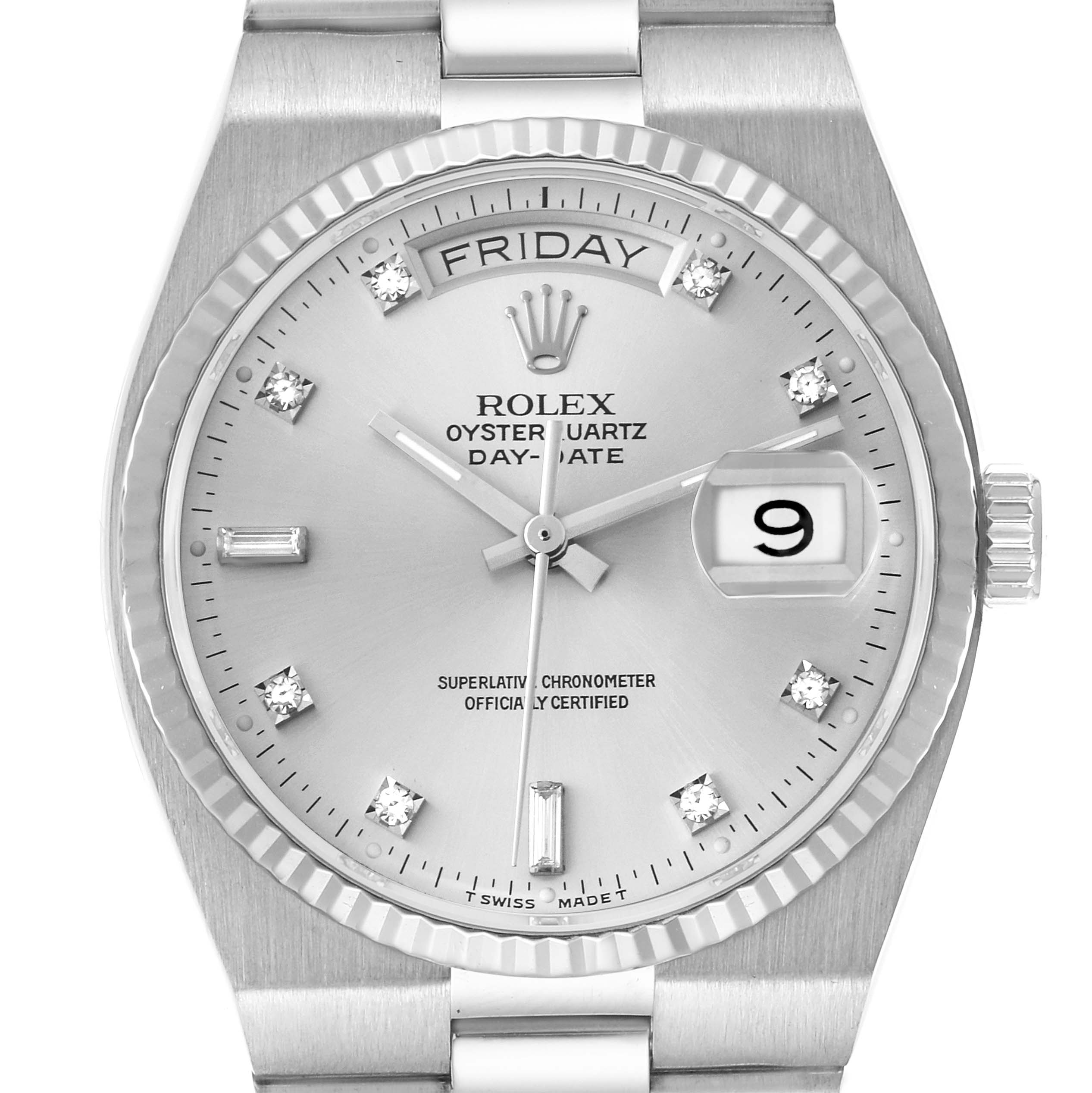 The Rolex Oysterquartz 19091 Men's White Gold Silver Dial 19091 Men's White Gold Silver Dial watch is shown from the front, highlighting the dial, day-date window, markers, hands, and bezel.