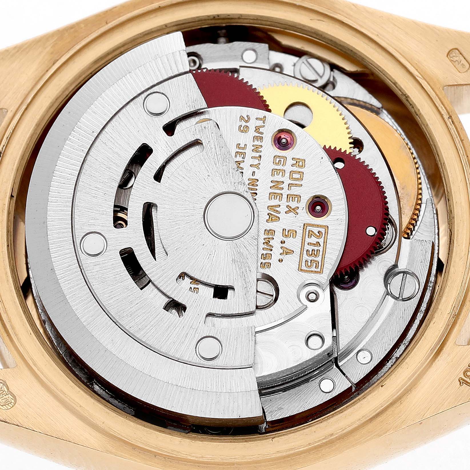 The image shows the movement of a Rolex President 69178 Women's Yellow Gold Champagne Dial watch viewed from the back, highlighting its intricate mechanical parts.