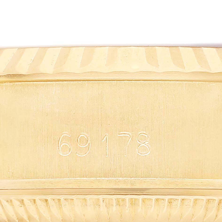 The image shows the side of a Rolex President 69178 Women's Yellow Gold Silver Dial watch, highlighting the model number engraving on the case.