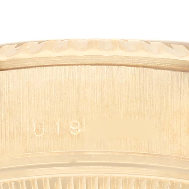 This image shows a close-up of the serial number engraving on the side of the case of a Rolex President 79178 Women
s Yellow Gold Champagne Dial 79178 Women
s Yellow Gold Champagne Dial watch.
