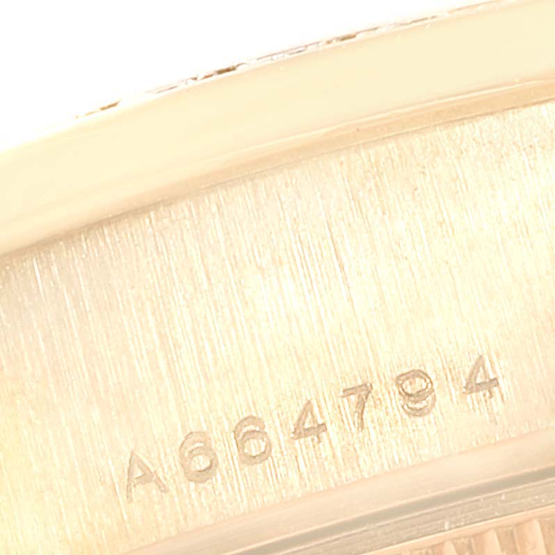 This is a close-up angle of the case back of the Rolex President 79138 Women
s Yellow Gold Silver Dial 79138 Women
s Yellow Gold Silver Dial model watch, showing its serial number.