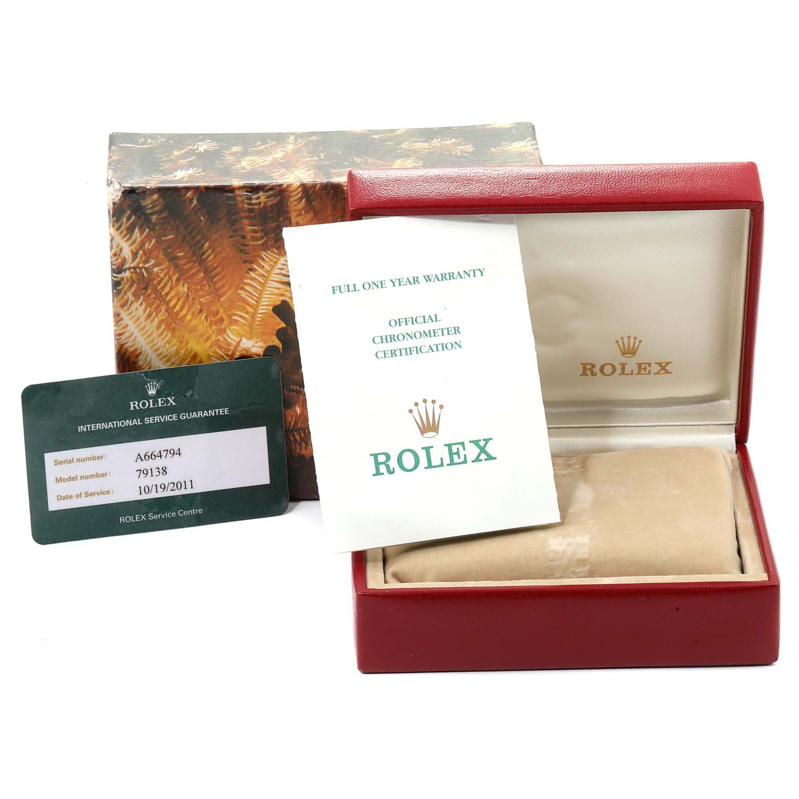 The image shows the packaging, warranty card, and certification for a Rolex President 79138 Women
s Yellow Gold Silver Dial 79138 Women
s Yellow Gold Silver Dial model.