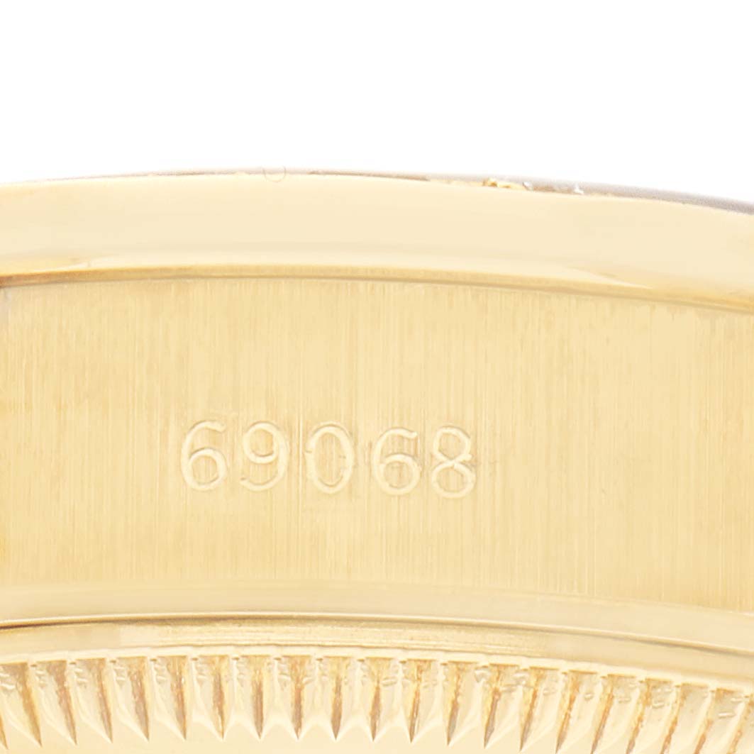 The image shows the side of a Rolex President 69068 Women's Yellow Gold Champagne Dial 69068 Women's Yellow Gold Champagne Dial model, highlighting its engraved model number.