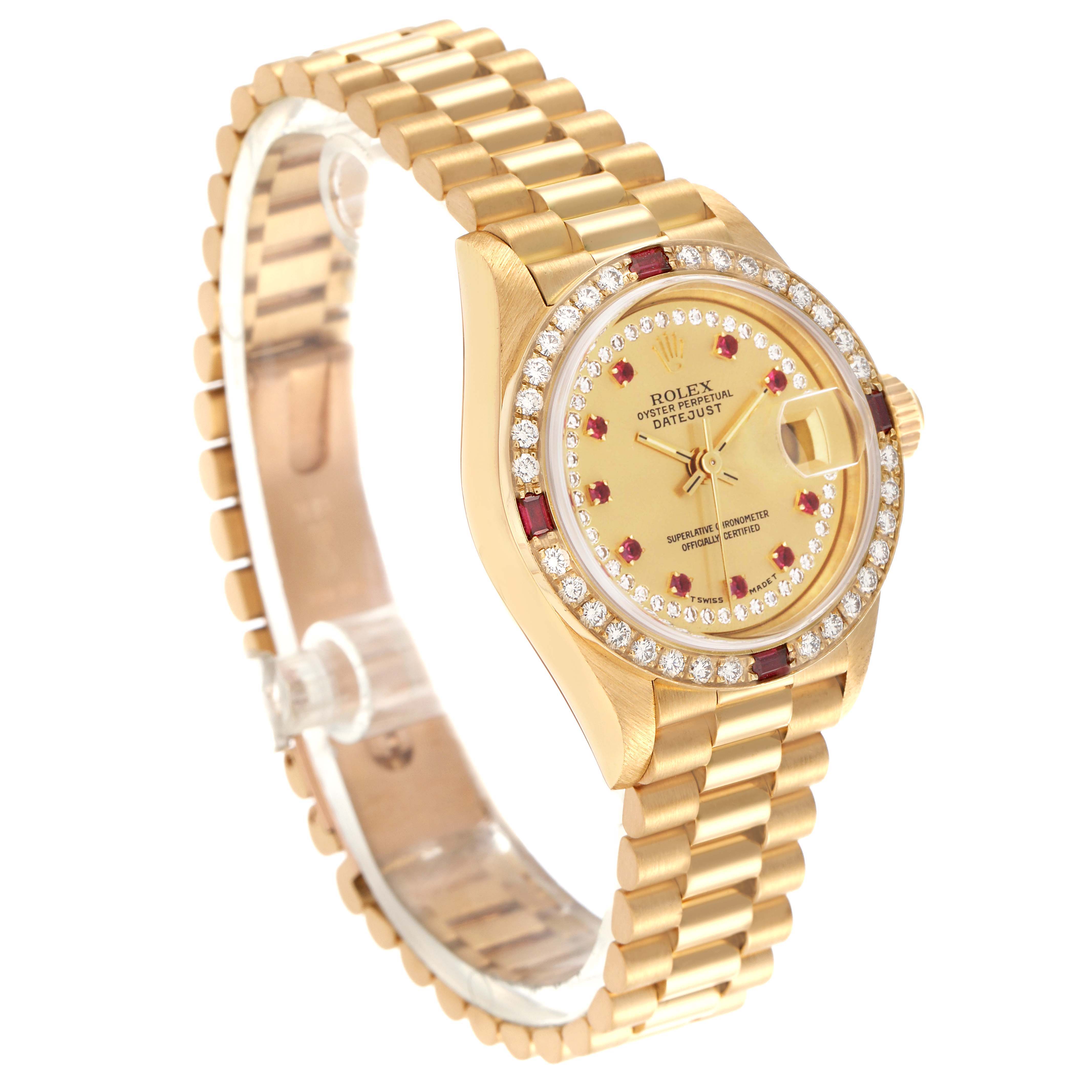The Rolex President 69068 Women's Yellow Gold Champagne Dial 69068 Women's Yellow Gold Champagne Dial watch is shown at a three-quarter angle, displaying its gold bracelet, jeweled bezel, and dial with a date feature.