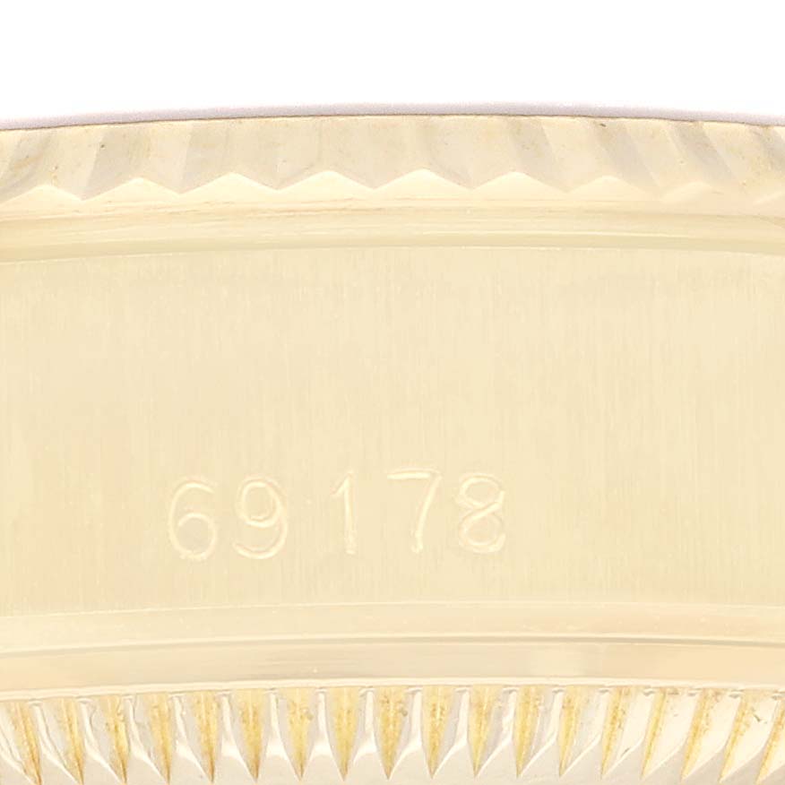 Close-up of the fluted bezel with the model number 69178 engraved on this Rolex President 69178 Women's Yellow Gold Champagne Dial 69178 Women's Yellow Gold Champagne Dial watch.