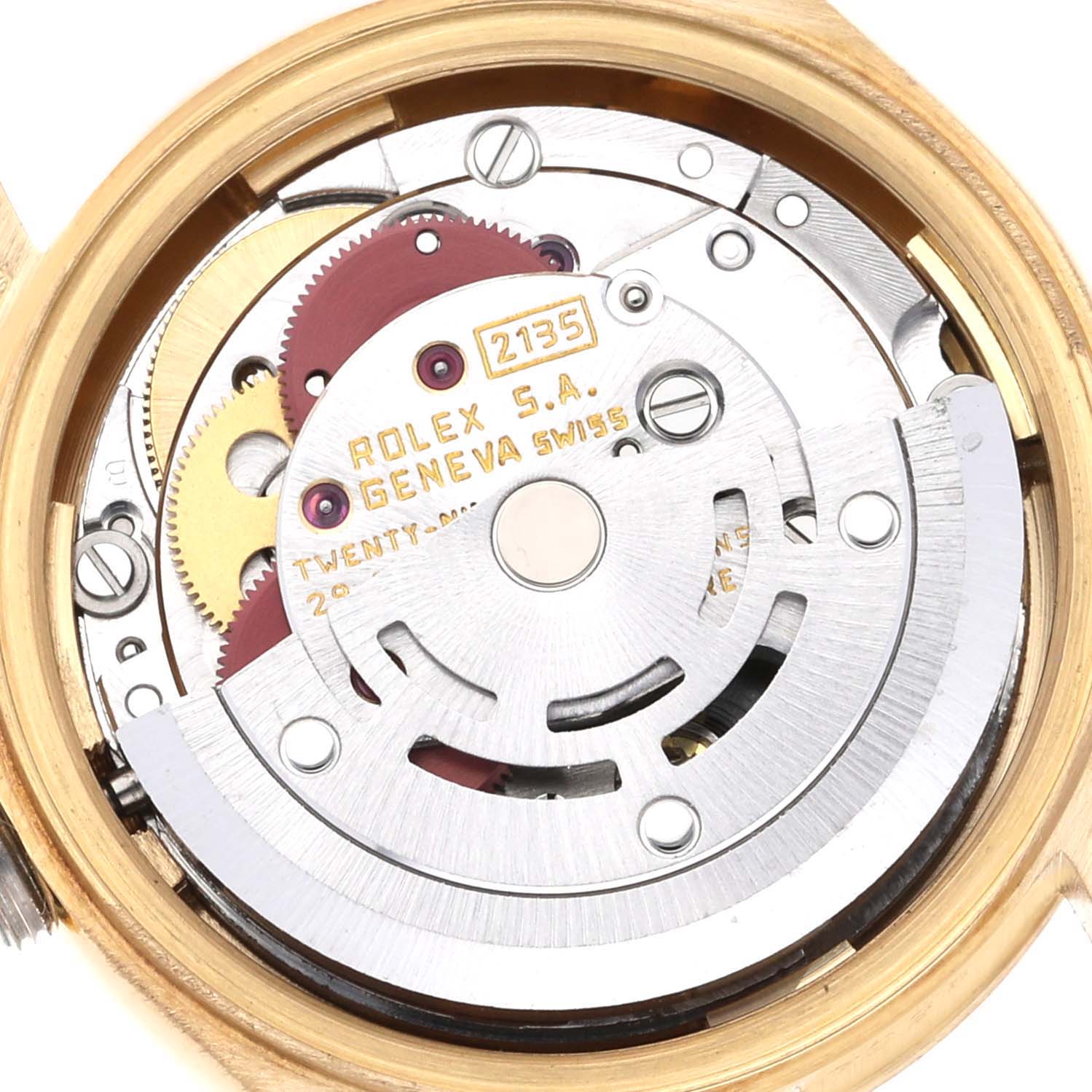 This is an internal, close-up view of the Rolex President 69178 Women's Yellow Gold Champagne Dial 69178 Women's Yellow Gold Champagne Dial model, showcasing its intricate movement and components.