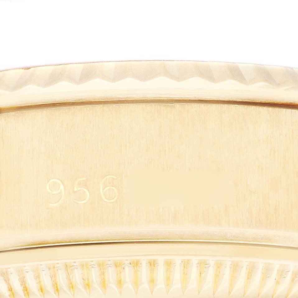 This close-up image shows a section of the bezel with detailed texture and part of the bracelet of a Rolex President 69178 Women's Yellow Gold Champagne Dial 69178 Women's Yellow Gold Champagne Dial model watch.