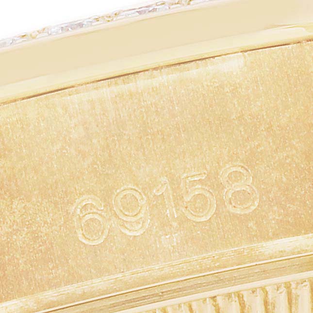 The image shows a close-up view of the case back of a Rolex President 69158 Women's Yellow Gold White Dial 69158 Women's Yellow Gold White Dial model 69158, highlighting its engraved reference numbers.