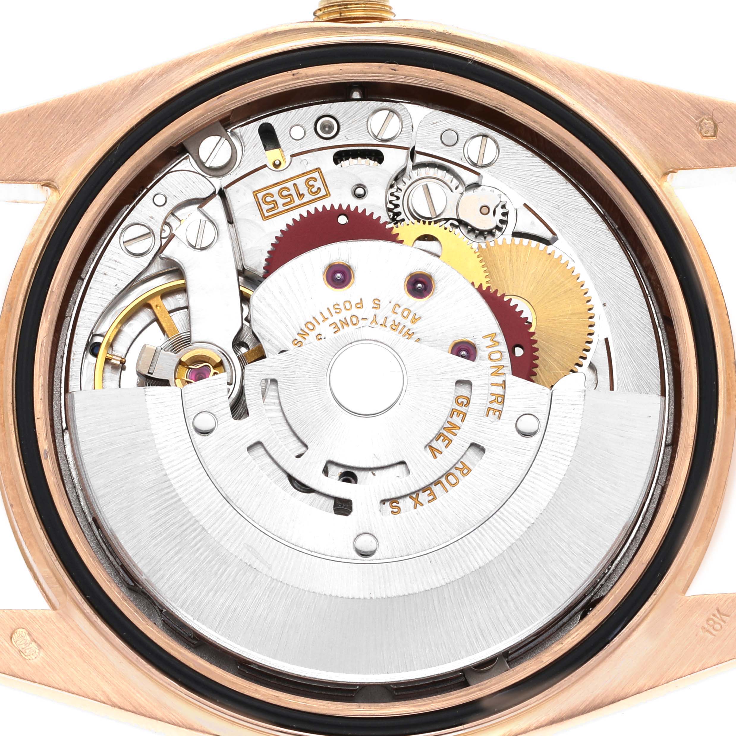 The image shows the Rolex President 118235 Men's Rose Gold Black Dial 118235 Men's Rose Gold Black Dial model's internal movement from the back, highlighting gears and intricate mechanics.