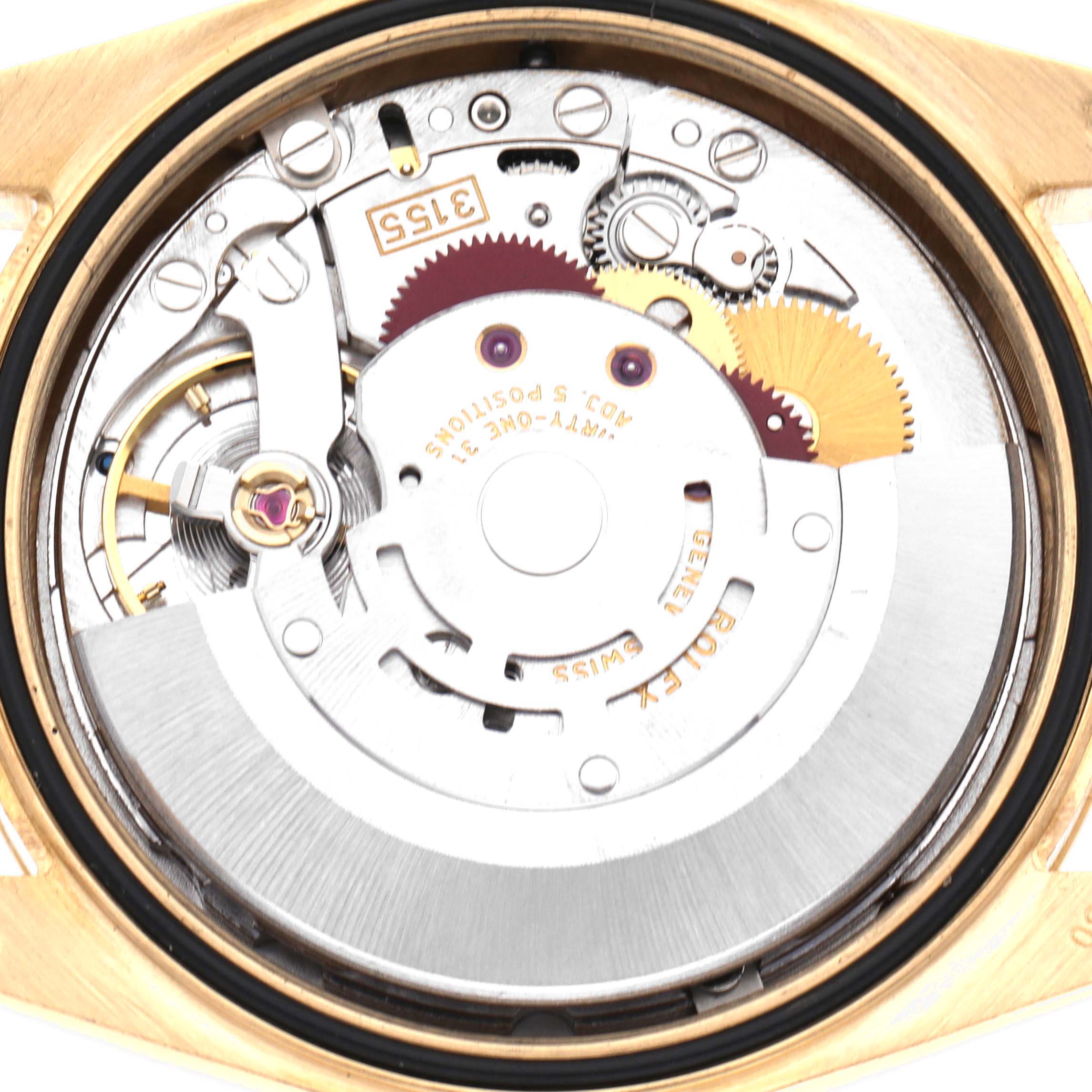 The image shows the movement of a Rolex President 118238 Men's Yellow Gold White Dial 118238 Men's Yellow Gold White Dial model, featuring gears and the rotor, viewed from the back.
