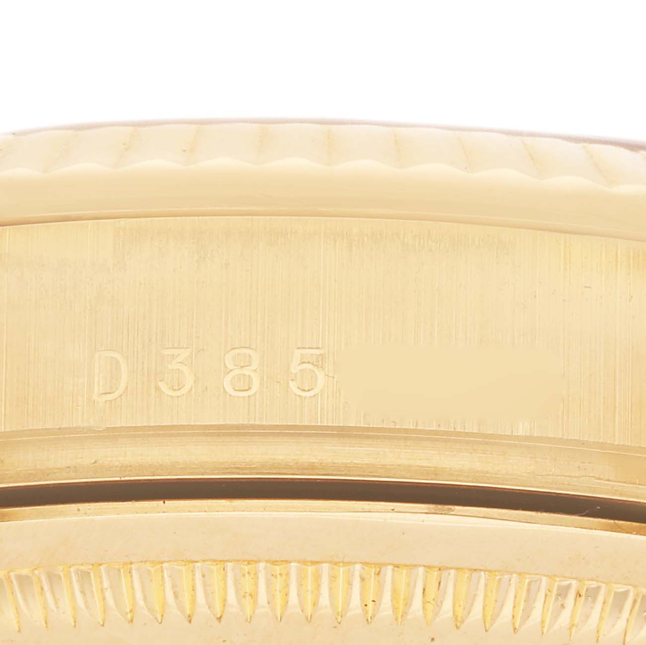 The image shows a close-up of the serial number engraving on the side of the bezel of a Rolex President 118238 Men's Yellow Gold White Dial 118238 Men's Yellow Gold White Dial watch.