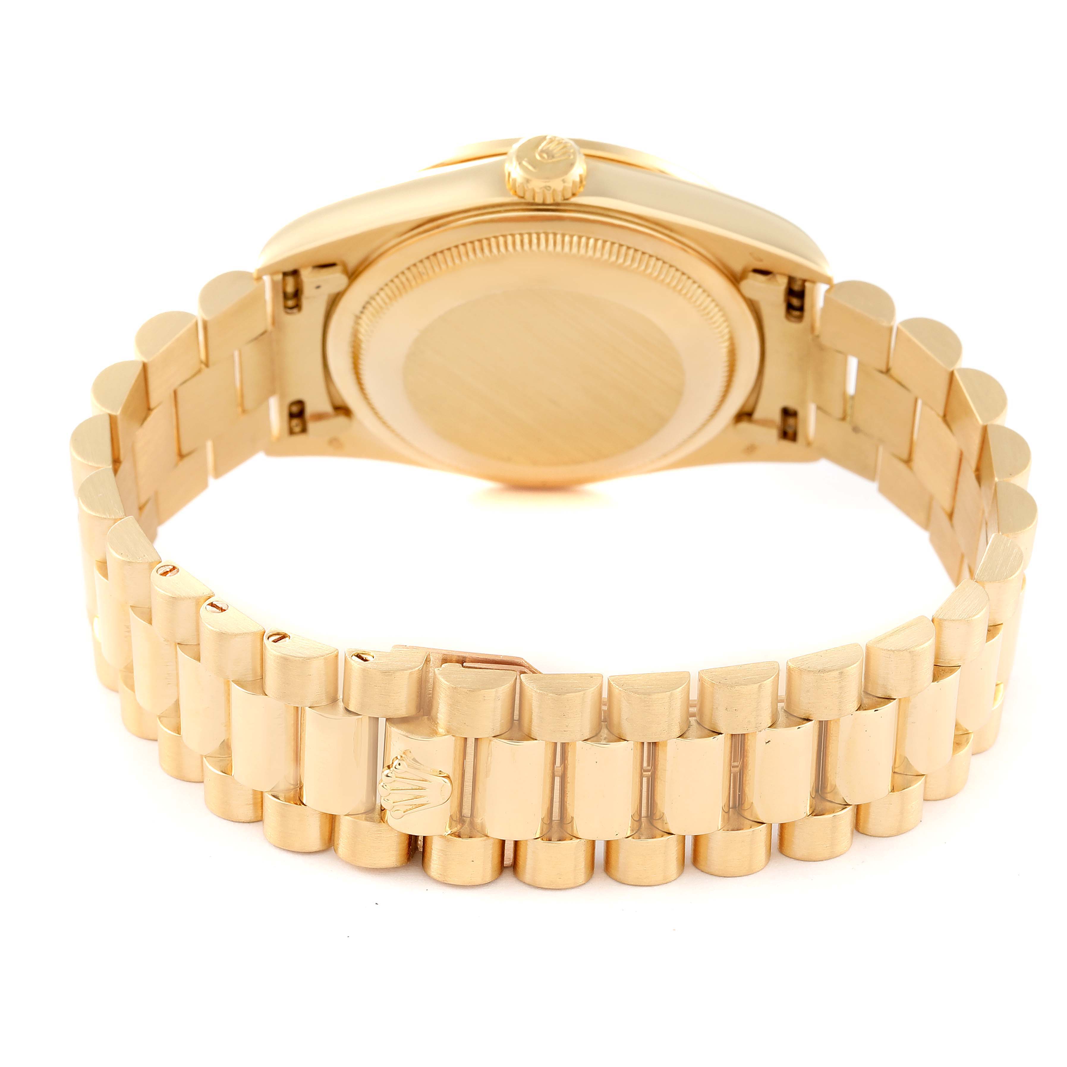 The image shows the back and bracelet of the Rolex President 18348 Men
s Yellow Gold Champagne Dial 18348 Men
s Yellow Gold Champagne Dial model watch at an angle showcasing the clasp and caseback.
