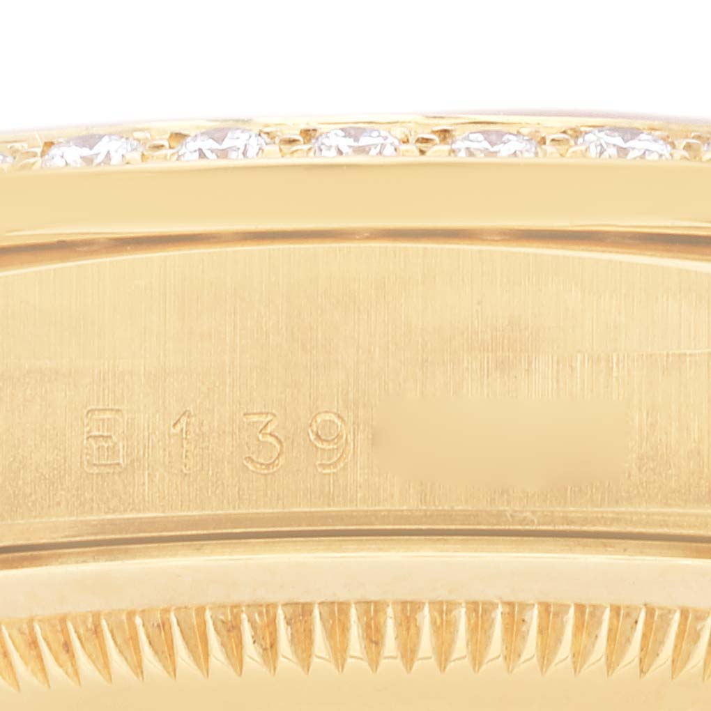 This close-up shows the side profile of a Rolex President 18348 Men
s Yellow Gold Champagne Dial 18348 Men
s Yellow Gold Champagne Dial model watch bezel, displaying the engraved serial numbers.