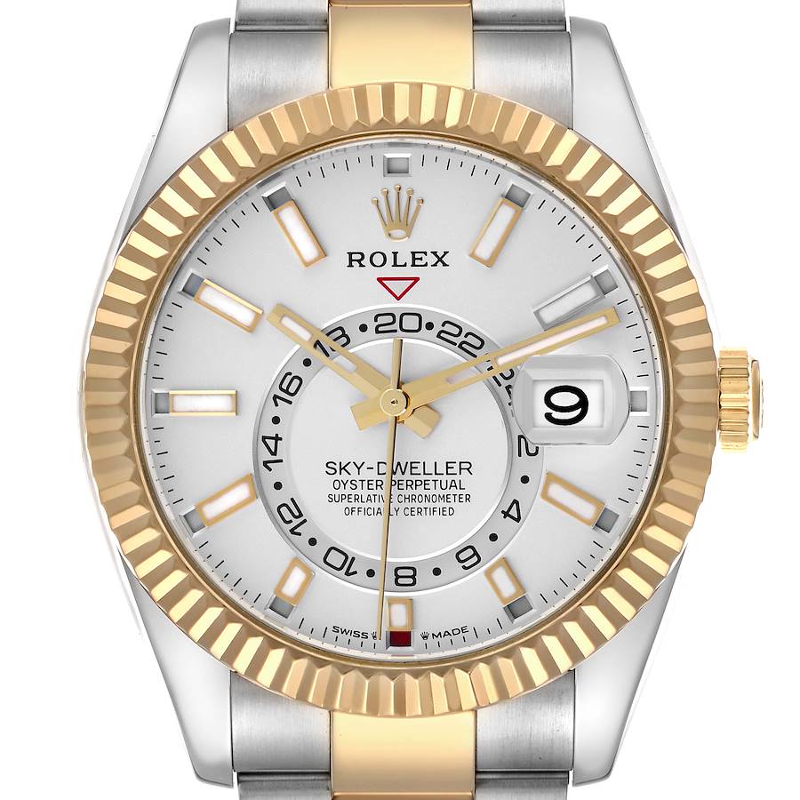 The image shows a front view of the Rolex Sky-Dweller, highlighting the bezel, dial, and hands.