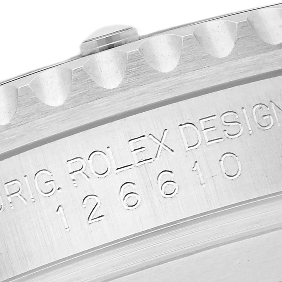 The image shows a close-up view of the case back and part of the edge of a Rolex Submariner 126610 Men
s Stainless Steel Black Dial 126610 Men
s Stainless Steel Black Dial, highlighting the model number and "ROLEX DESIGN" engraving.