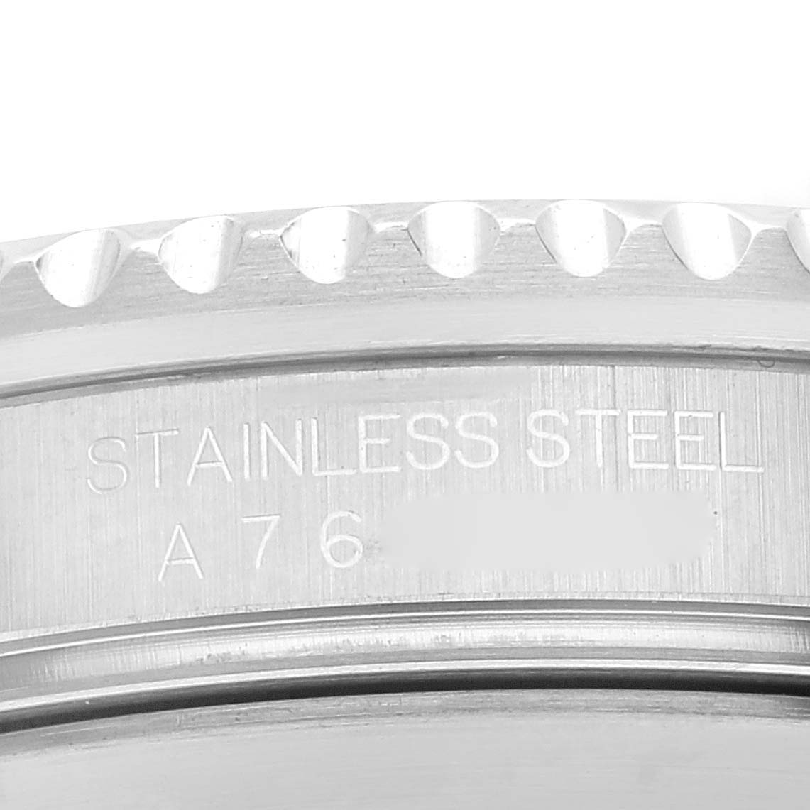 This close-up of a Rolex Submariner 16610 Men
s Stainless Steel Black Dial 16610 Men
s Stainless Steel Black Dial watch shows the engraving on the stainless steel case.