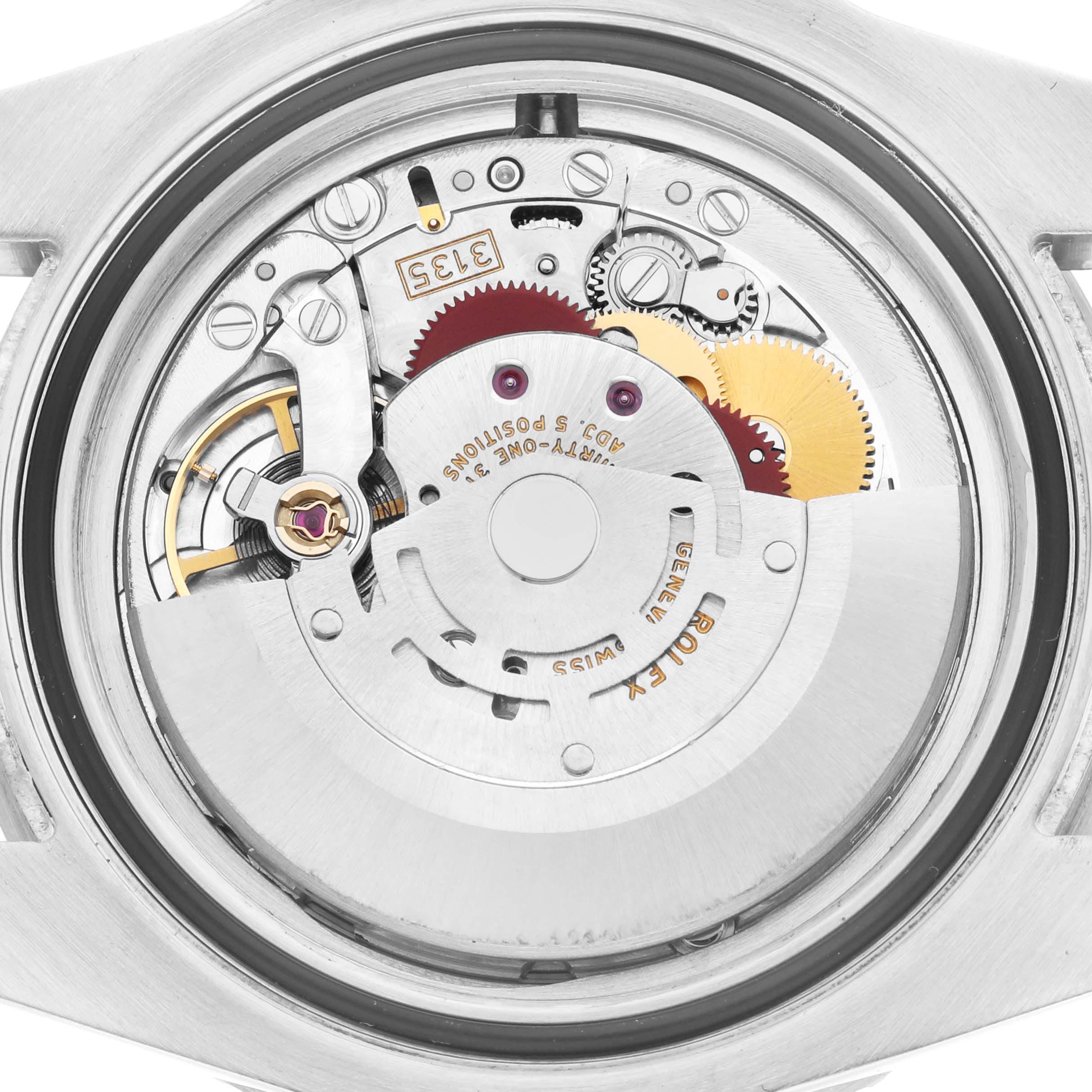 The image shows the Rolex Submariner 116610LN Men
s Stainless Steel Black Dial 116610LN Men
s Stainless Steel Black Dial
s movement from the back, highlighting gears, screws, and the rotor.