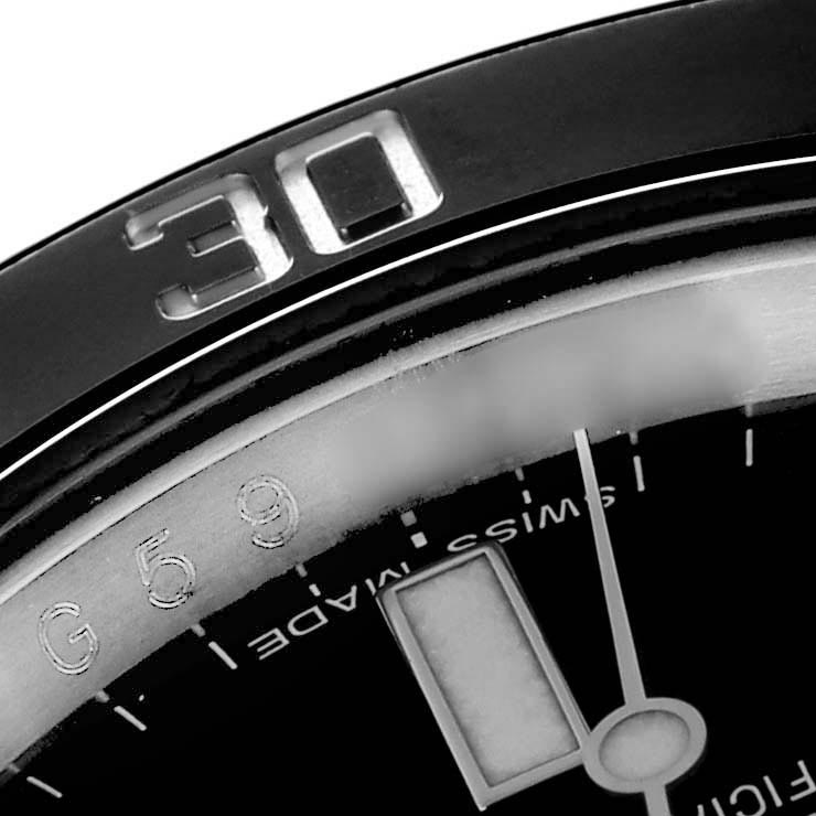 The image shows a close-up of the Rolex Submariner 116610LN Men
s Stainless Steel Black Dial 116610LN Men
s Stainless Steel Black Dial
s bezel and part of the dial displaying the minute hand and markers.