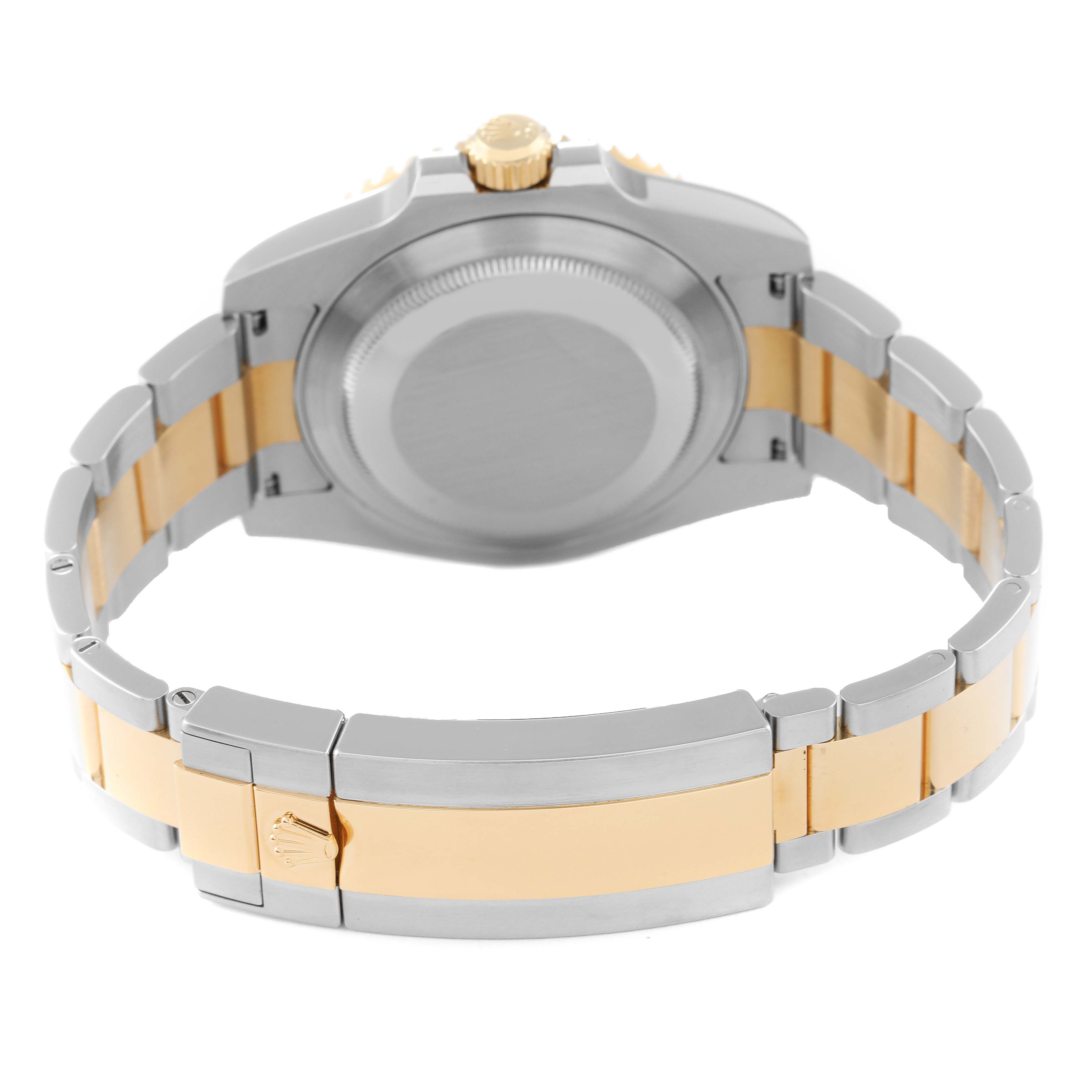 The image shows the back of a Rolex Submariner 116613 Men
s Steel and Gold (two tone) Blue Dial 116613 Men
s Steel and Gold (two tone) Blue Dial watch, highlighting the case back and two-tone bracelet.