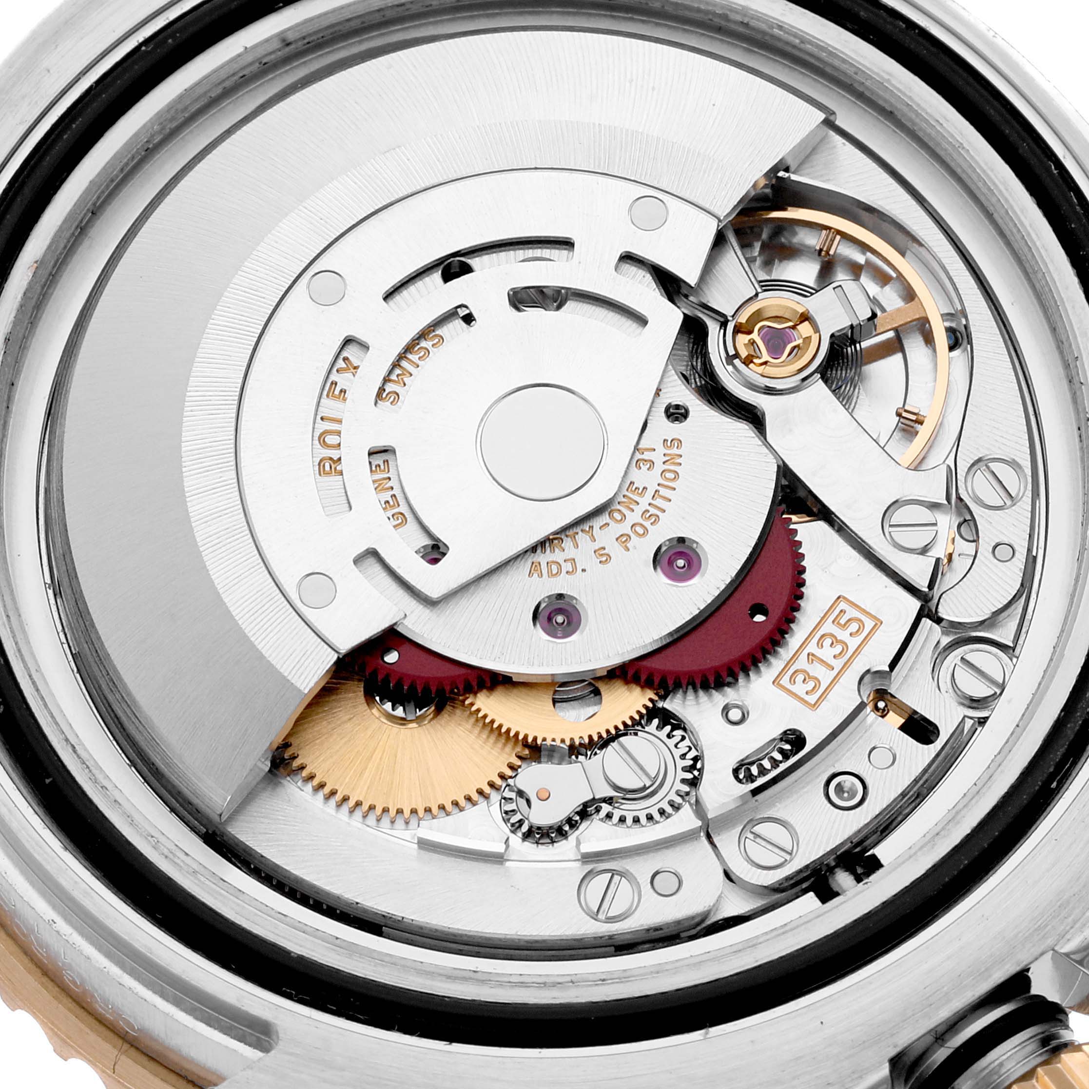 This image shows the detailed inner mechanisms and movement parts of a Rolex Submariner 116613 Men
s Steel and Gold (two tone) Blue Dial 116613 Men
s Steel and Gold (two tone) Blue Dial watch from a rear angle.