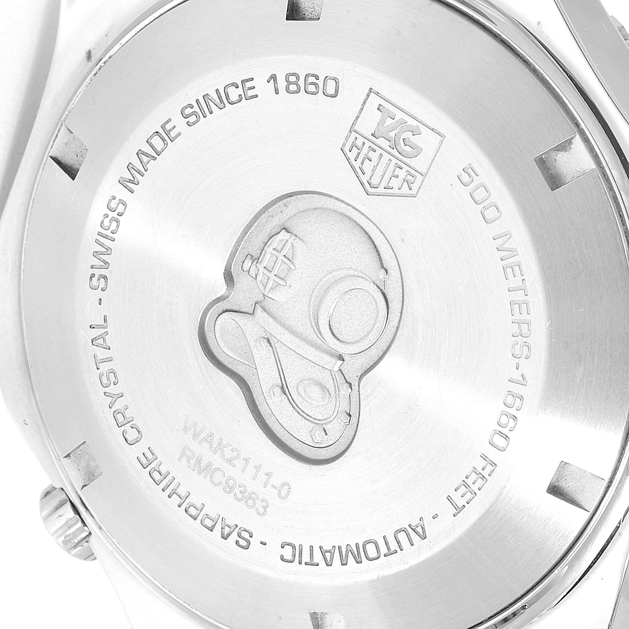 This image shows the case back of a Tag Heuer Aquaracer WAK2111.BA0830 Men's Stainless Steel Blue Dial WAK2111.BA0830 Men's Stainless Steel Blue Dial watch, featuring engravings and a diver's helmet logo.