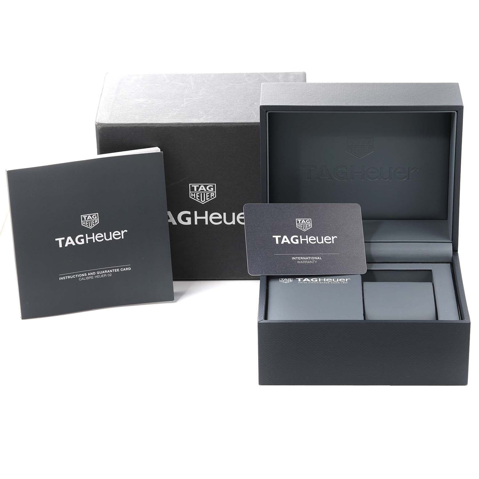 The image shows the packaging, instruction manual, and warranty card for the Tag Heuer Monaco CBL2113 Men
s Stainless Steel Black Dial CBL2113 Men
s Stainless Steel Black Dial watch.