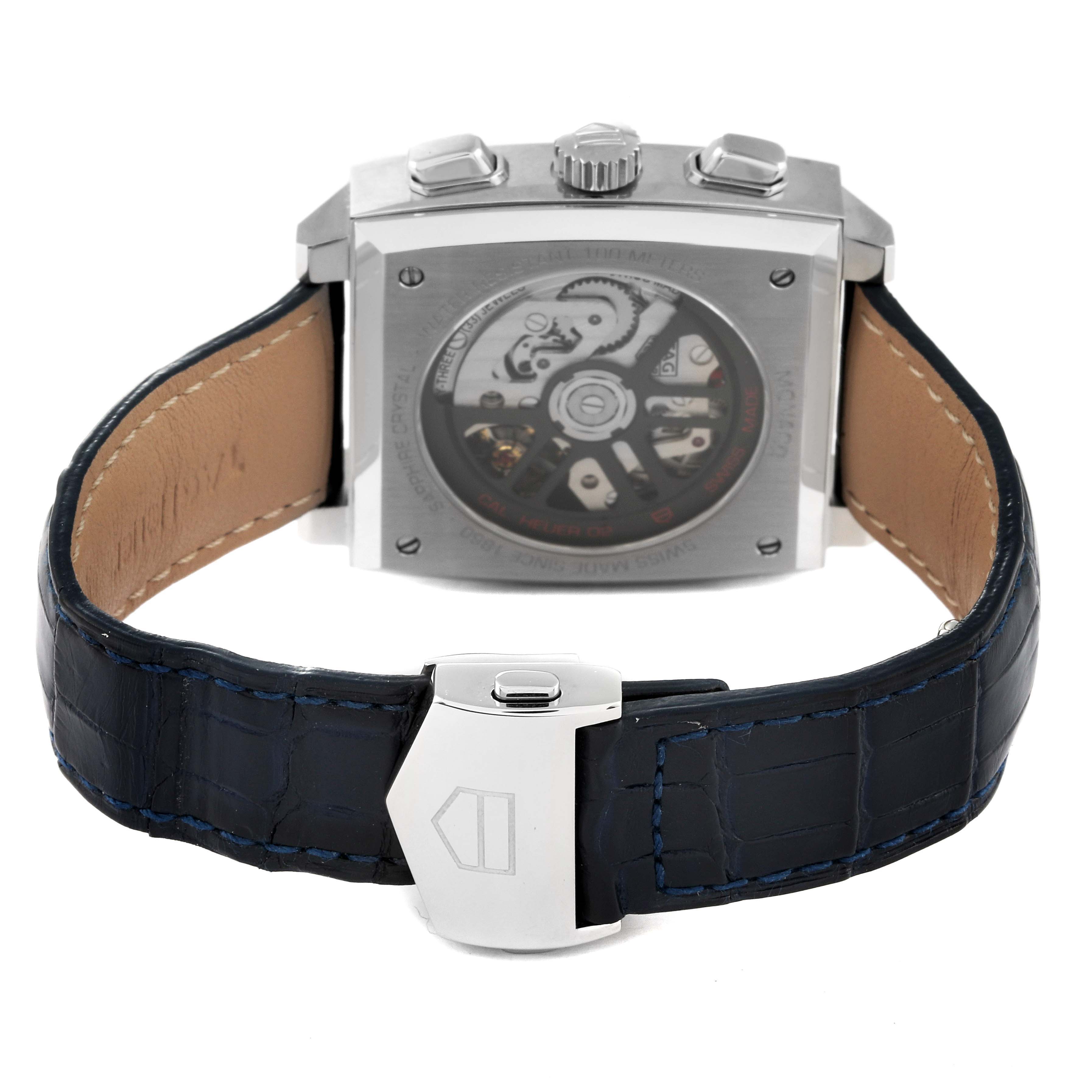 The image shows the back view of a Tag Heuer Monaco CBL2111.FC6453 Men's Stainless Steel Blue Dial CBL2111.FC6453 Men's Stainless Steel Blue Dial watch, displaying the movement through the case back and the leather strap with clasp.