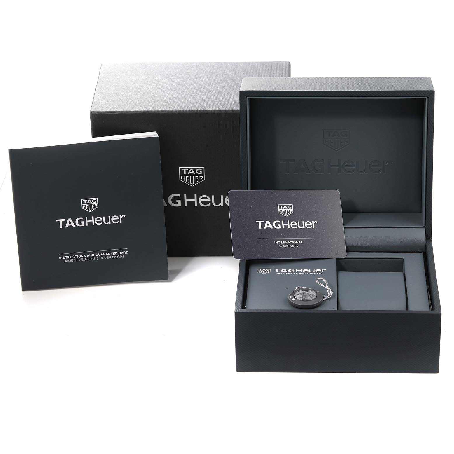 The image shows the packaging box, instruction manual, and warranty card for the Tag Heuer Monaco CBL2111.FC6453 Men's Stainless Steel Blue Dial CBL2111.FC6453 Men's Stainless Steel Blue Dial watch.