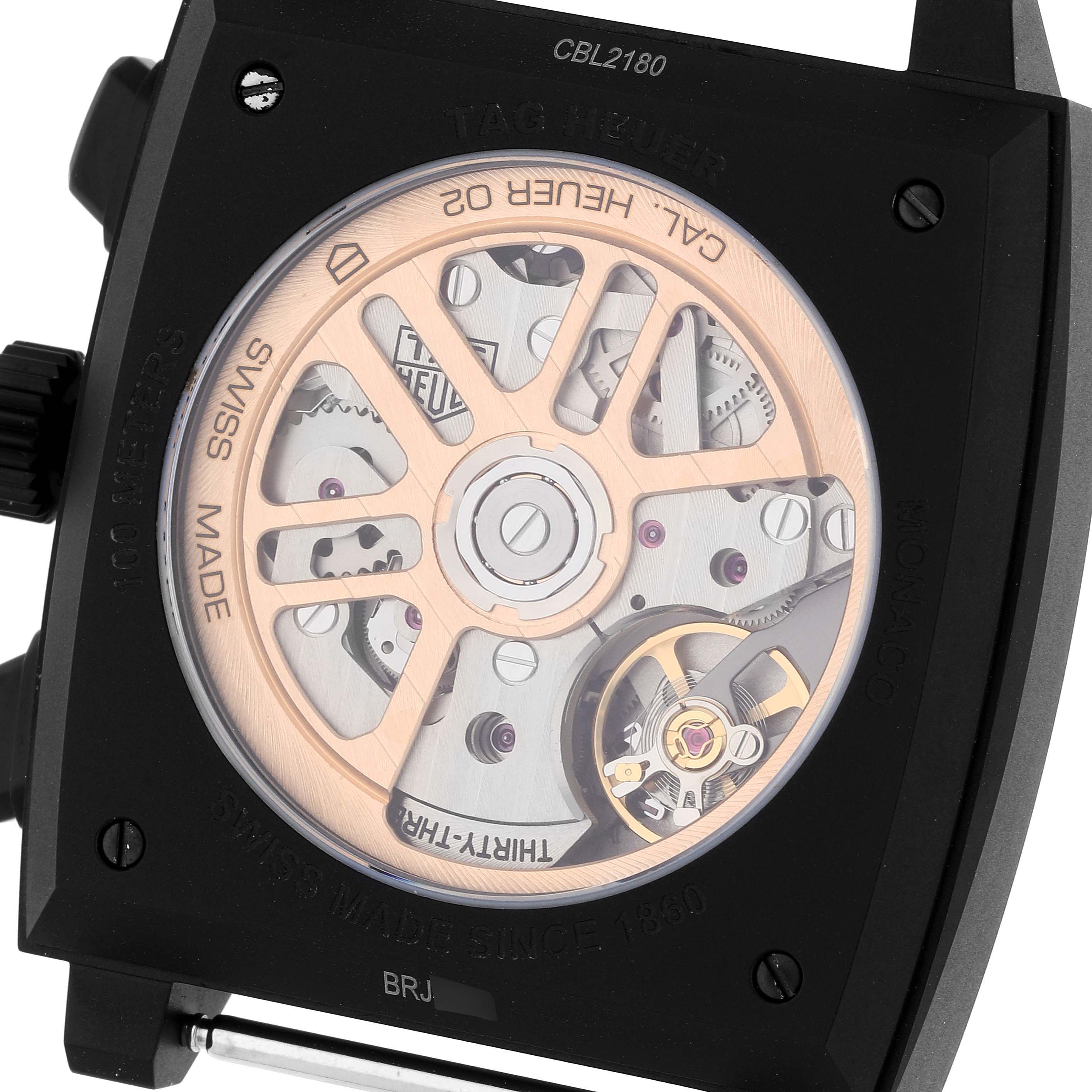 This image shows a close-up of the back view of the Tag Heuer Monaco CBL2180 Men's Titanium Black Dial CBL2180 Men's Titanium Black Dial watch, highlighting its movement and internal mechanics.