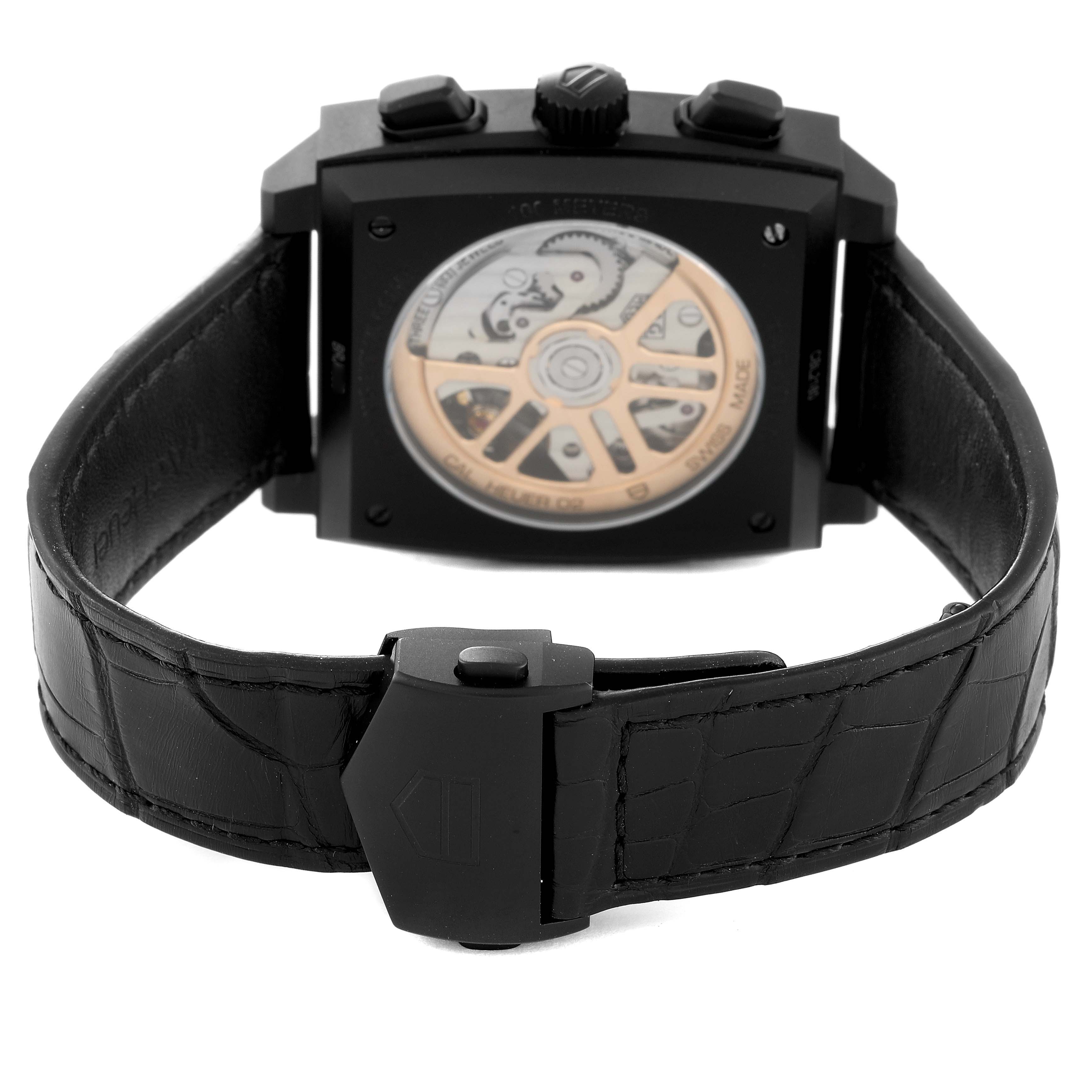 This image shows the back of a Tag Heuer Monaco CBL2180 Men's Titanium Black Dial CBL2180 Men's Titanium Black Dial watch, highlighting its movement and part of the leather strap.