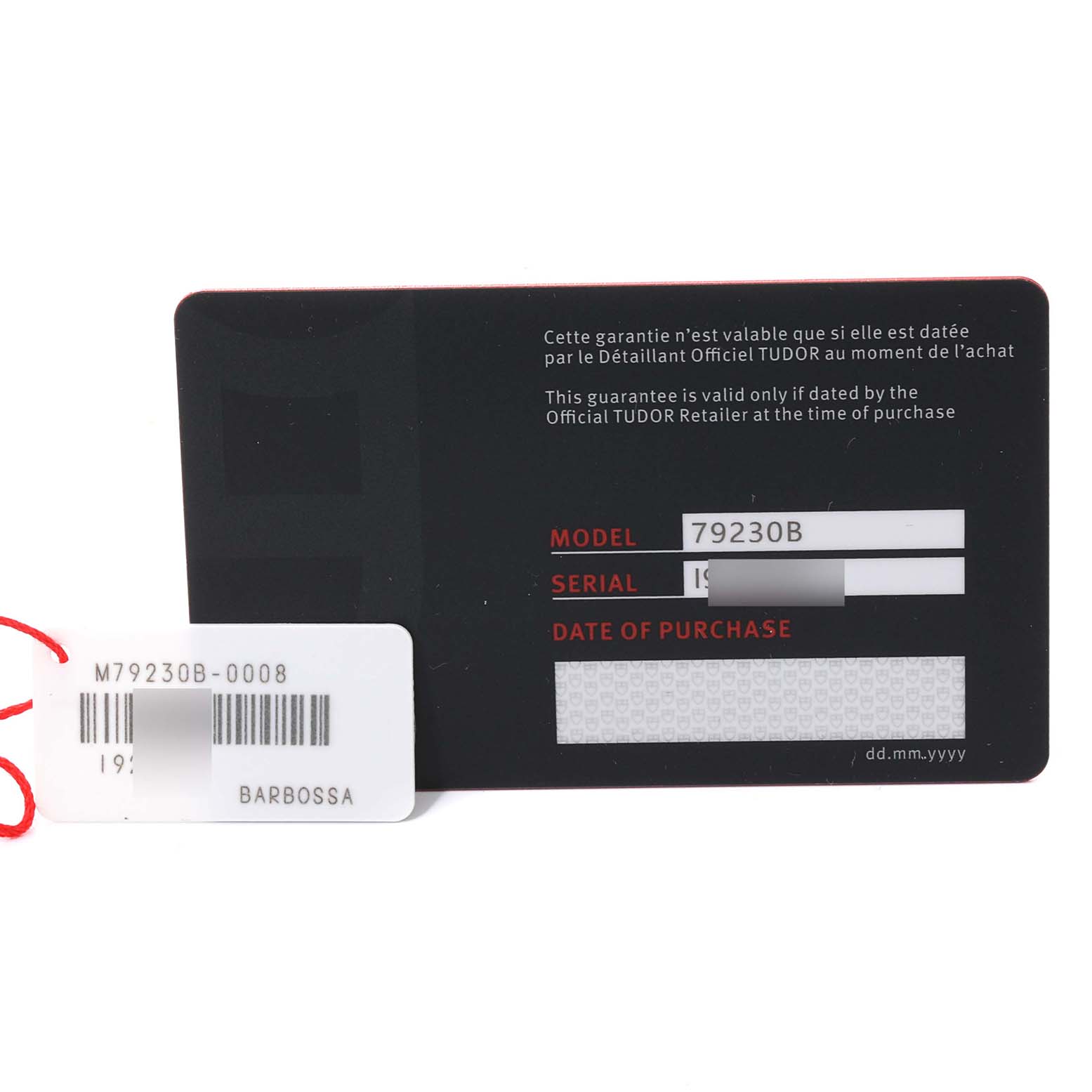 This image shows the warranty card and a tag for the Tudor Heritage Black Bay 79230B Men's Stainless Steel Black Dial 79230B Men's Stainless Steel Black Dial model 79230B.