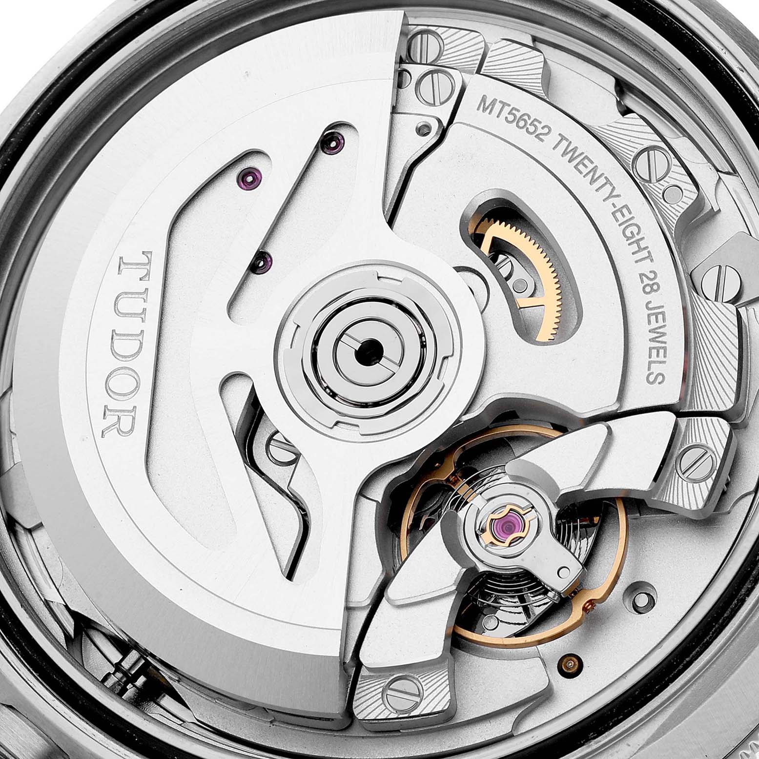 This close-up image shows the intricate internal mechanism of the Tudor Heritage Black Bay 79830RB Men
s Stainless Steel Black Dial 79830RB Men
s Stainless Steel Black Dial watch, including gears and jewels.