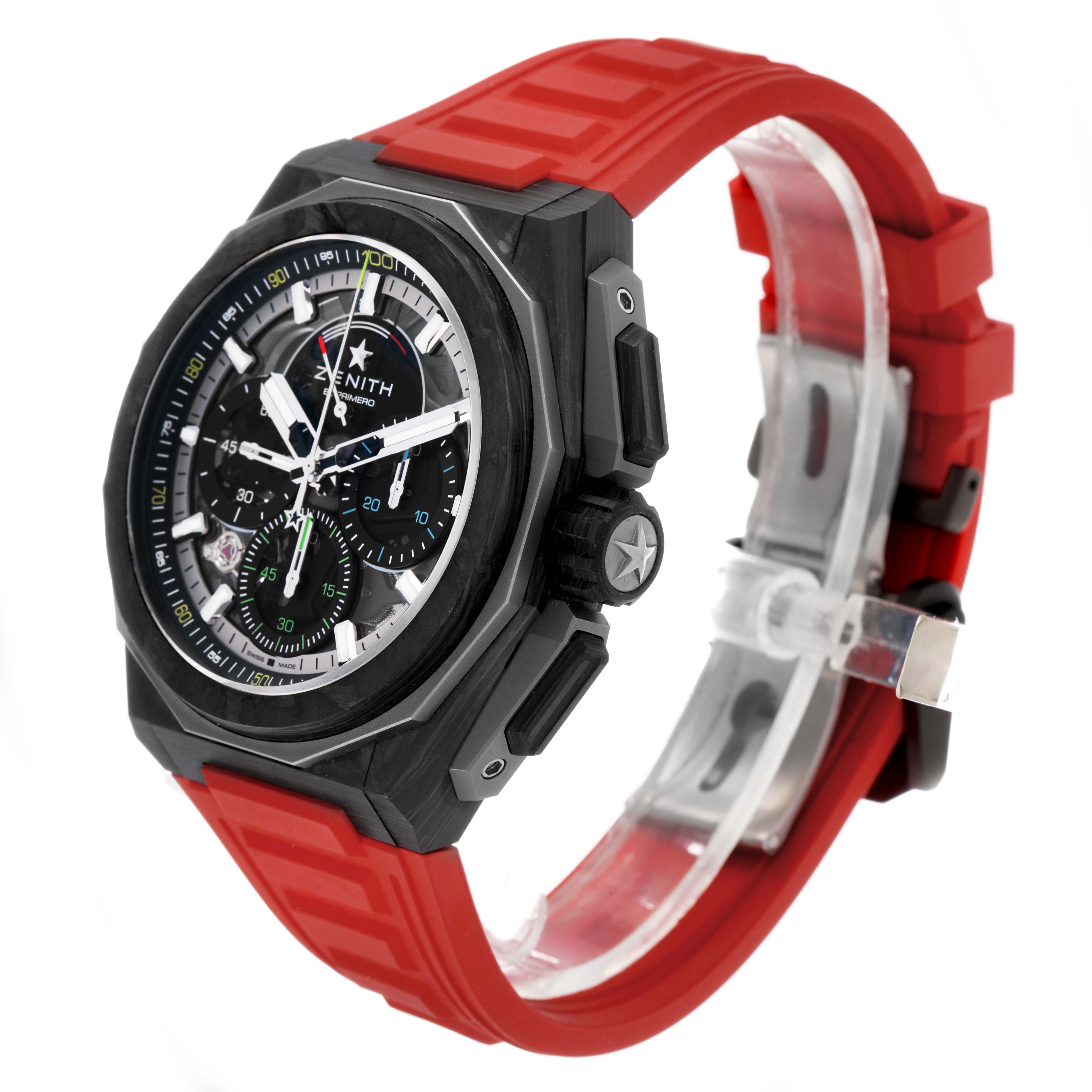 The Zenith Defy 10.9100.9004/22.I200 Men's Ceramic Black Dial watch is shown at a three-quarter angle, highlighting the dial, bezel, crown, and red strap.