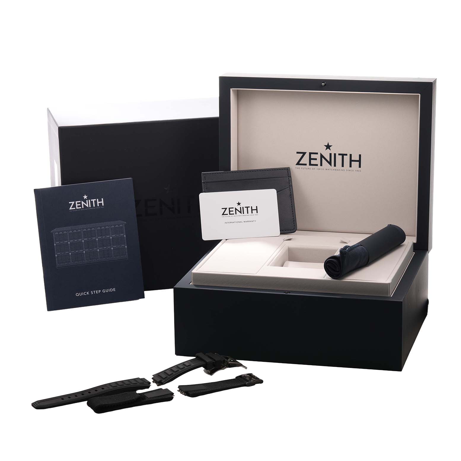 The Zenith Defy 10.9100.9004/22.I200 Men's Ceramic Black Dial set is shown from a front angle, featuring the open box, documentation, straps, and accessory compartments.