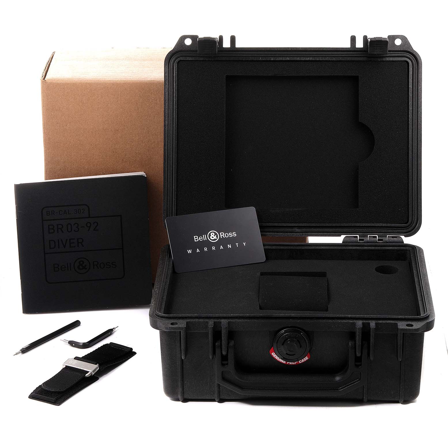 The image shows the packaging and accessories for the Bell & Ross Diver BR03-92, including a watch case, tools, strap, and warranty card.