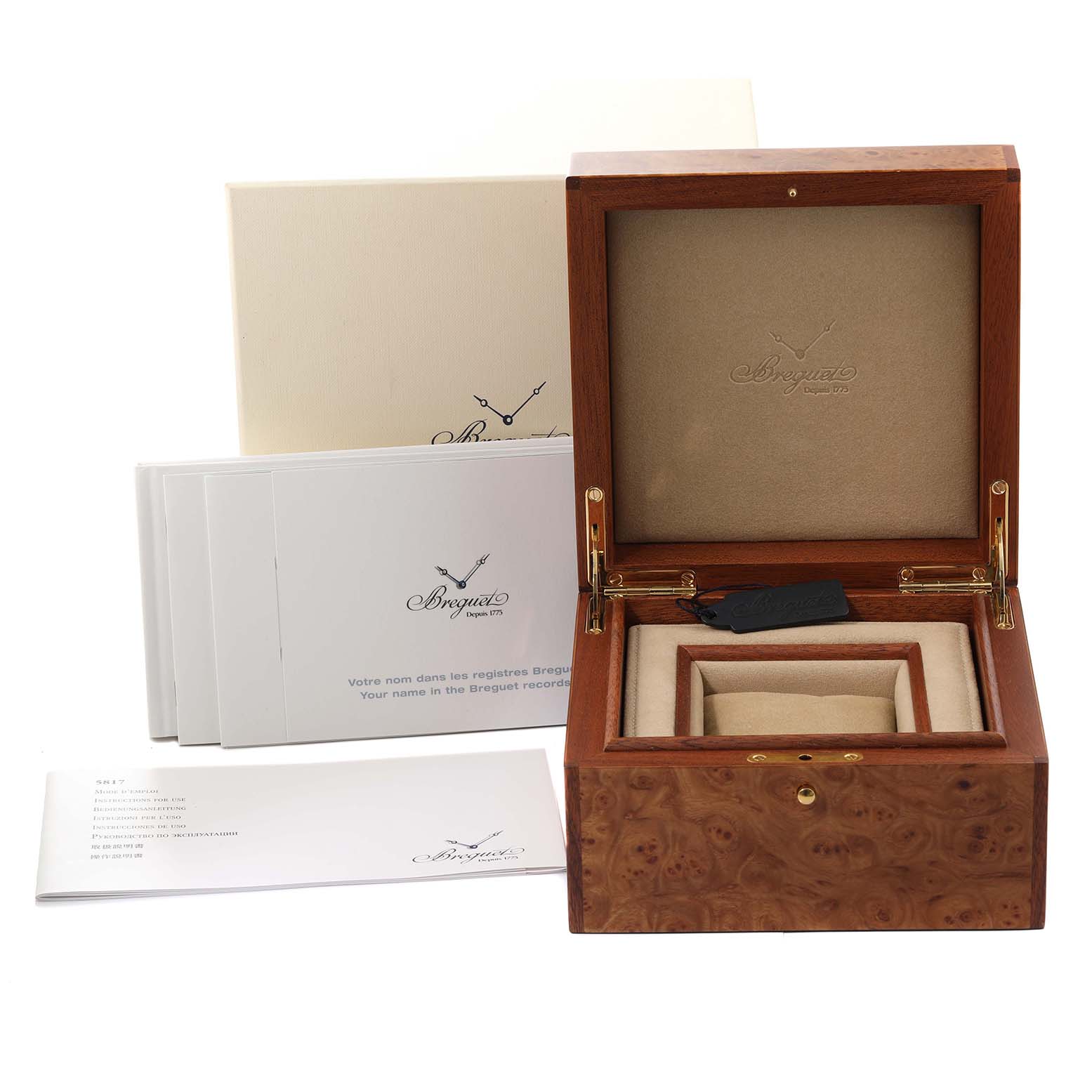 The image shows a Breguet Marine 5817BA/12/9V8 Men
s Yellow Gold Silver Dial 5817BA/12/9V8 Men
s Yellow Gold Silver Dial model watch box and warranty booklets from a slightly elevated front angle.