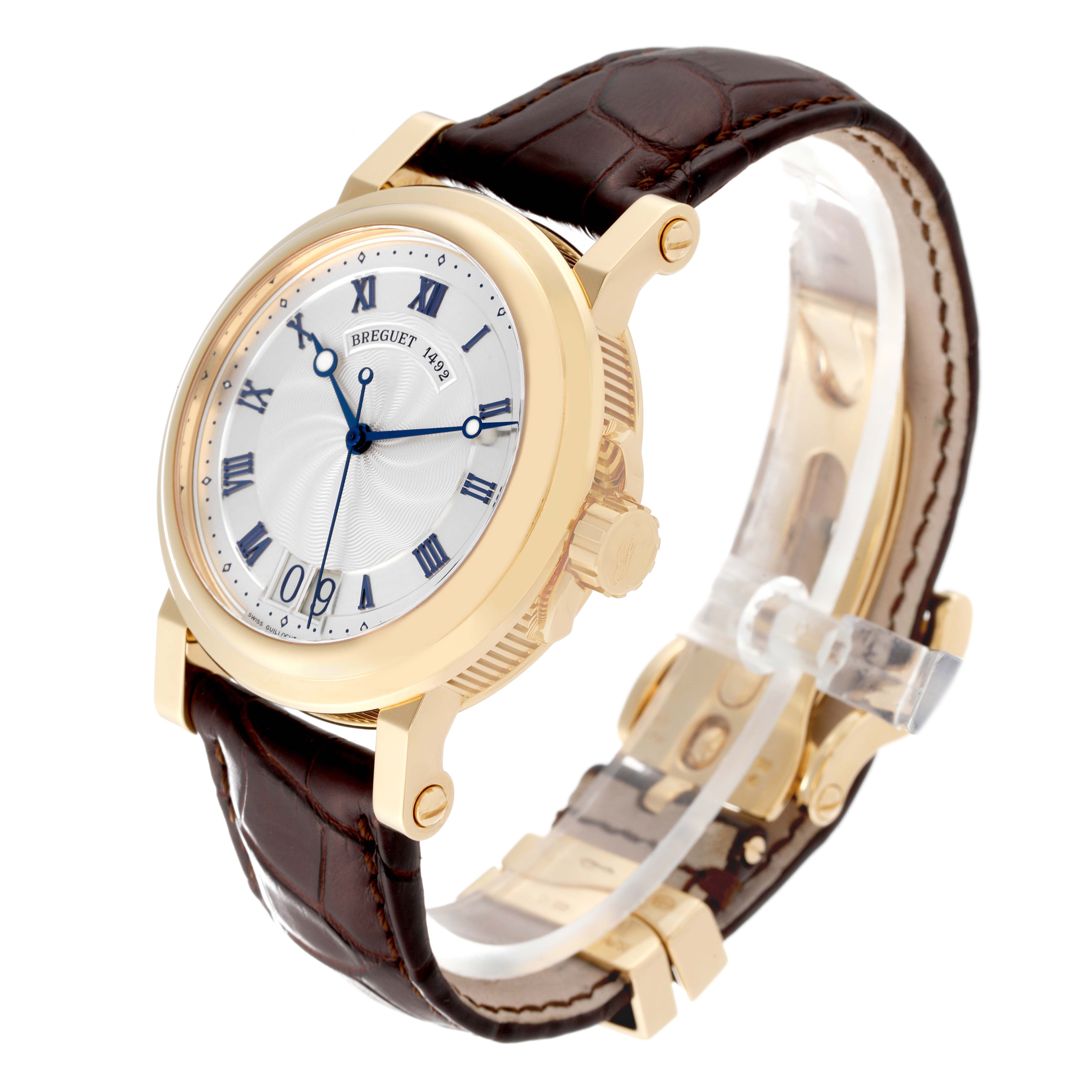 The Breguet Marine 5817BA/12/9V8 Men
s Yellow Gold Silver Dial 5817BA/12/9V8 Men
s Yellow Gold Silver Dial model watch is depicted at a slight angle, showing its face, crown, and leather strap.