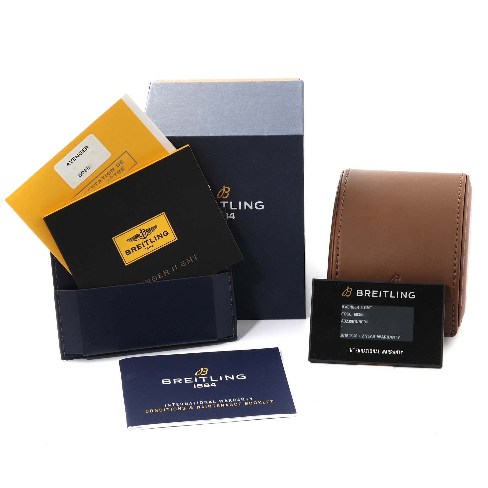 The image shows the Breitling Avenger A32390 Men's Stainless Steel Black Dial A32390 Men's Stainless Steel Black Dial watch's packaging, manuals, warranty cards, and carrying case from a front angle.