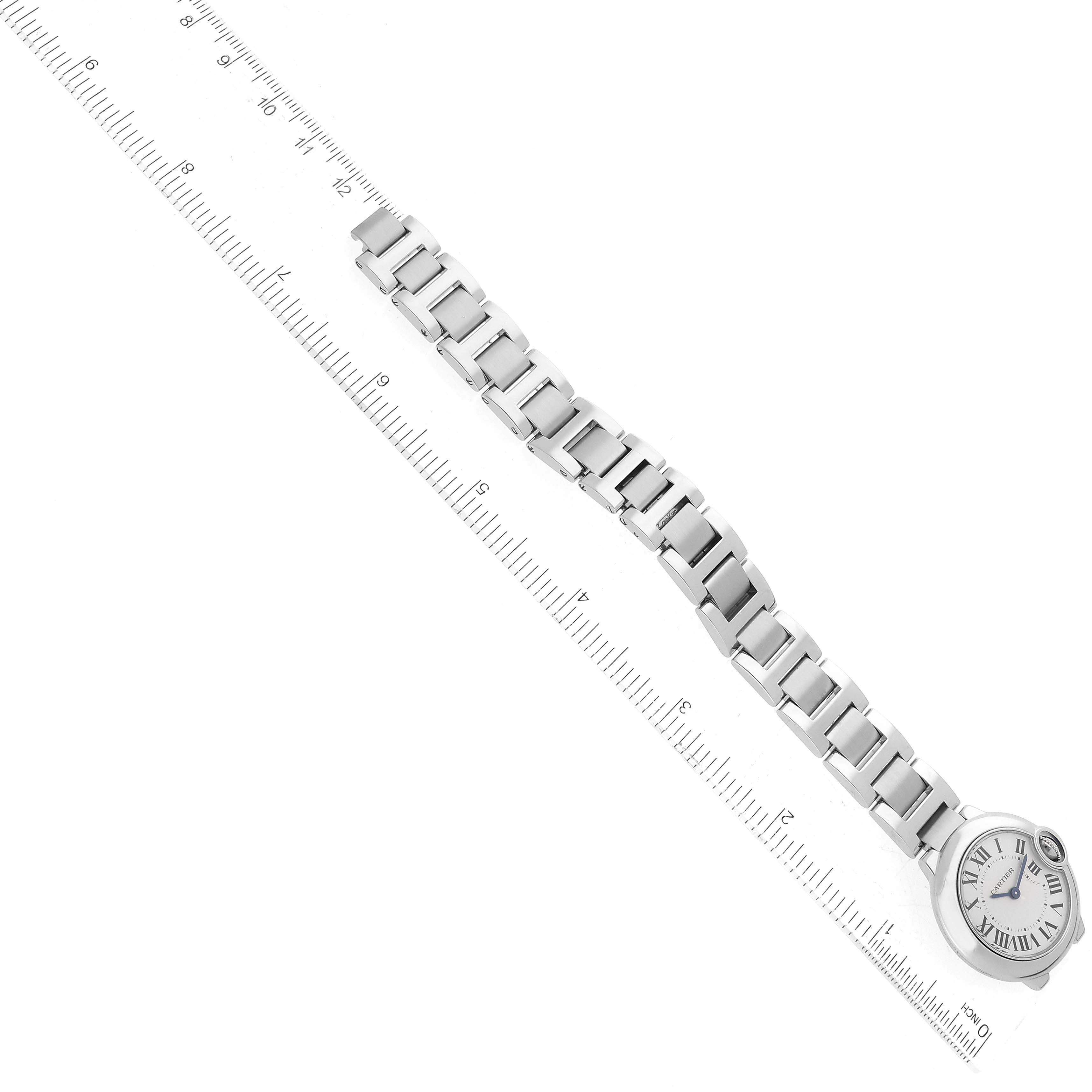 The image shows a Ballon Bleu model by Cartier watch laid flat with a ruler for scale.